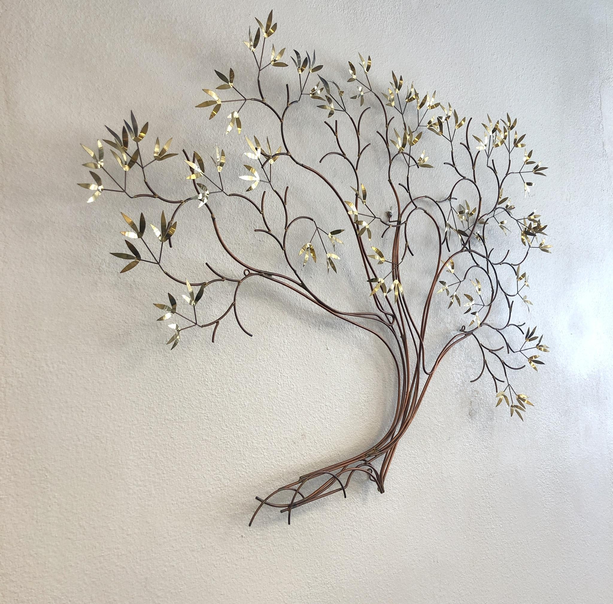 A large tree wall sculpture designed by Curtis Jeré in the 1980s. The sculpture is constructed of copper with the leafs polish brass. The sculpture is signed and dated 1981.
Dimension: 65” wide, 48” high, 6.5” deep.