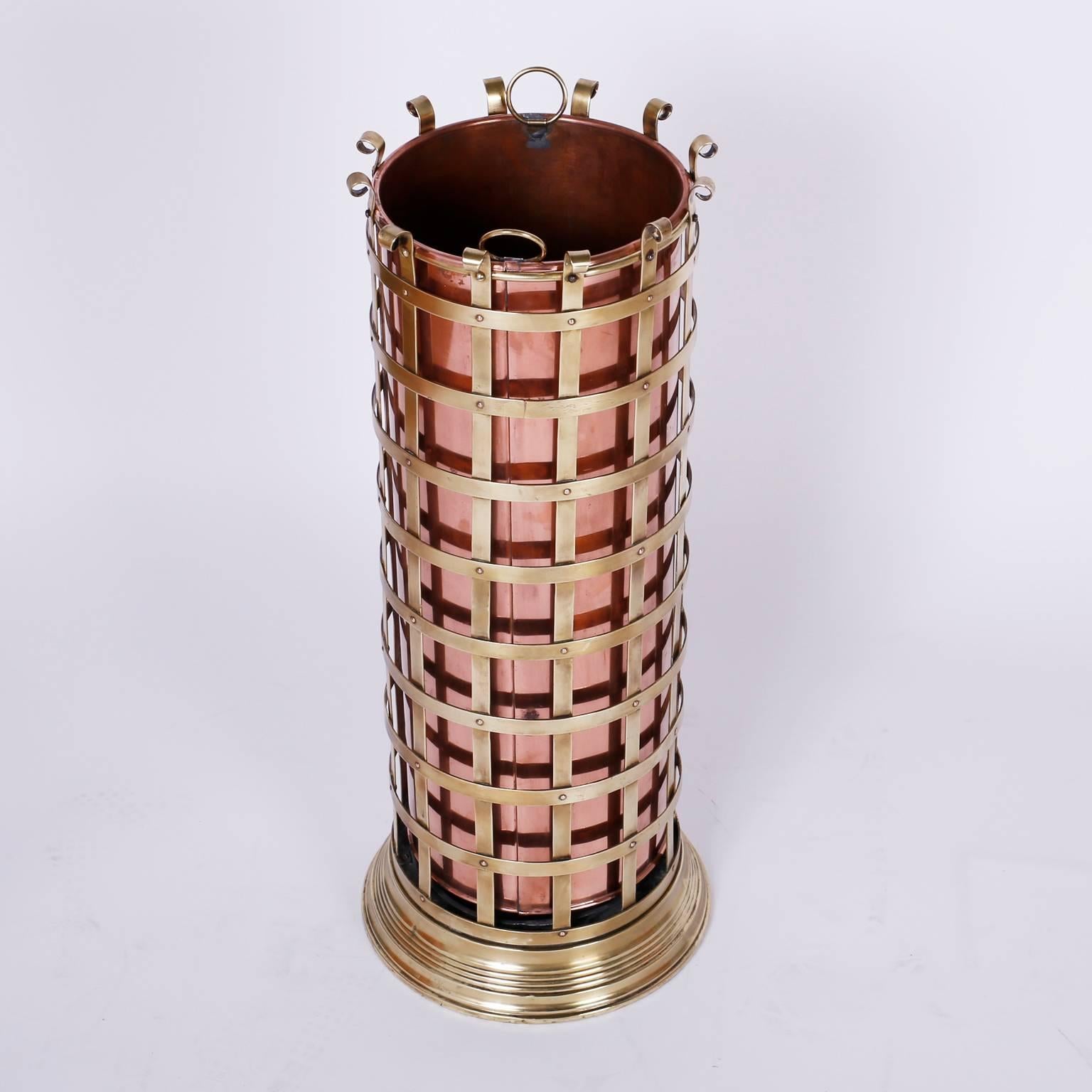 Arts & Crafts or Mission style mixed metal umbrella stand with a brass
case and copper canister insert. All hand polished and lacquered for
easy care.