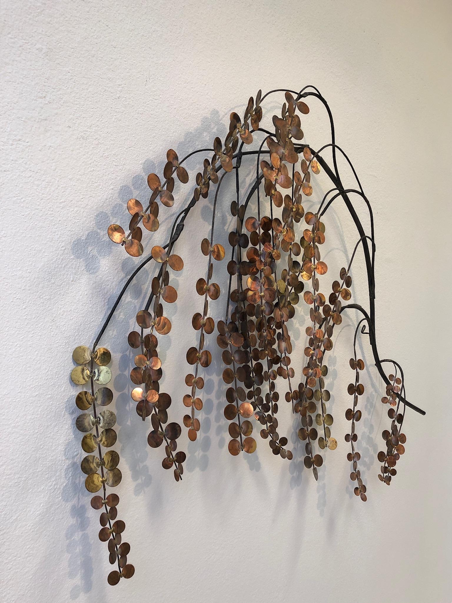 1970s copper and brass mixed metal wall sculpture depicting a tree branch, design by Curtis Jeré. 
The sculpture is hand signed (see detail photos).