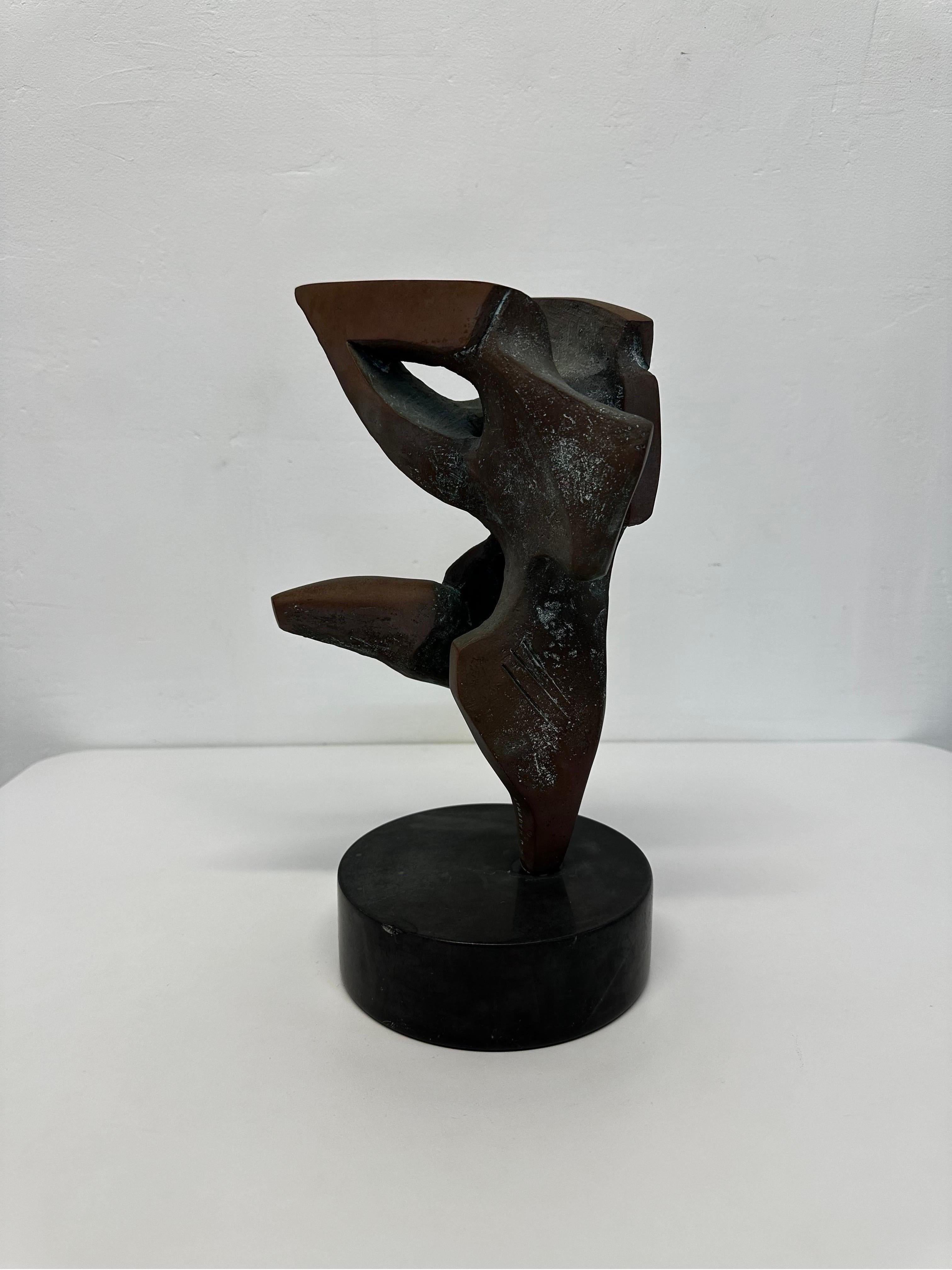 Abstract sculpture of a dancer using mixed metal copper and bronze.  The sculpture is affixed to a black granite base.  Signed and numbered.