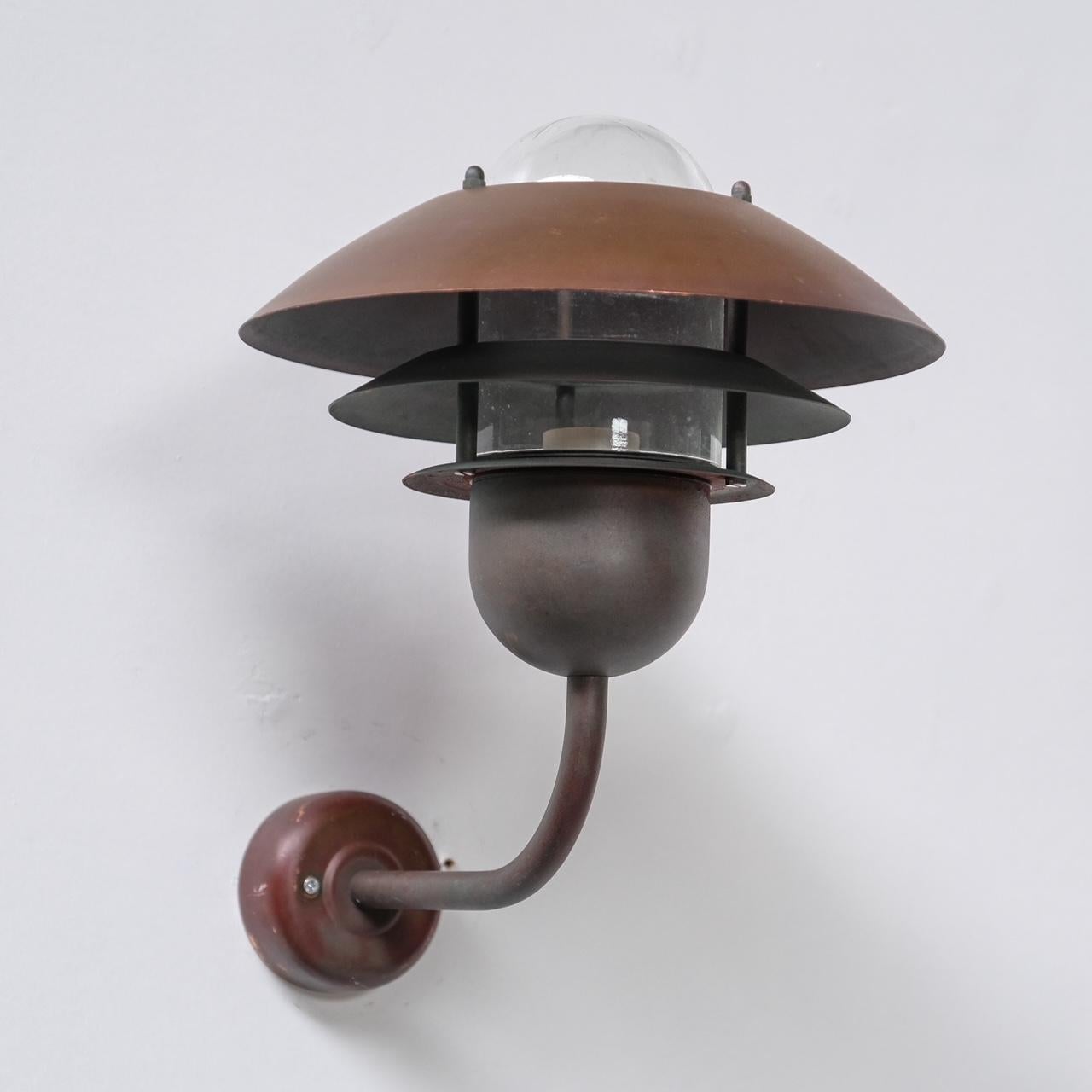 A copper wall light, that originally was used externally but equally would look amazing internally.

Denmark, circa 1990s.

Priced and sold individually.

Three available at time of listing, although we have others of a similar model and more