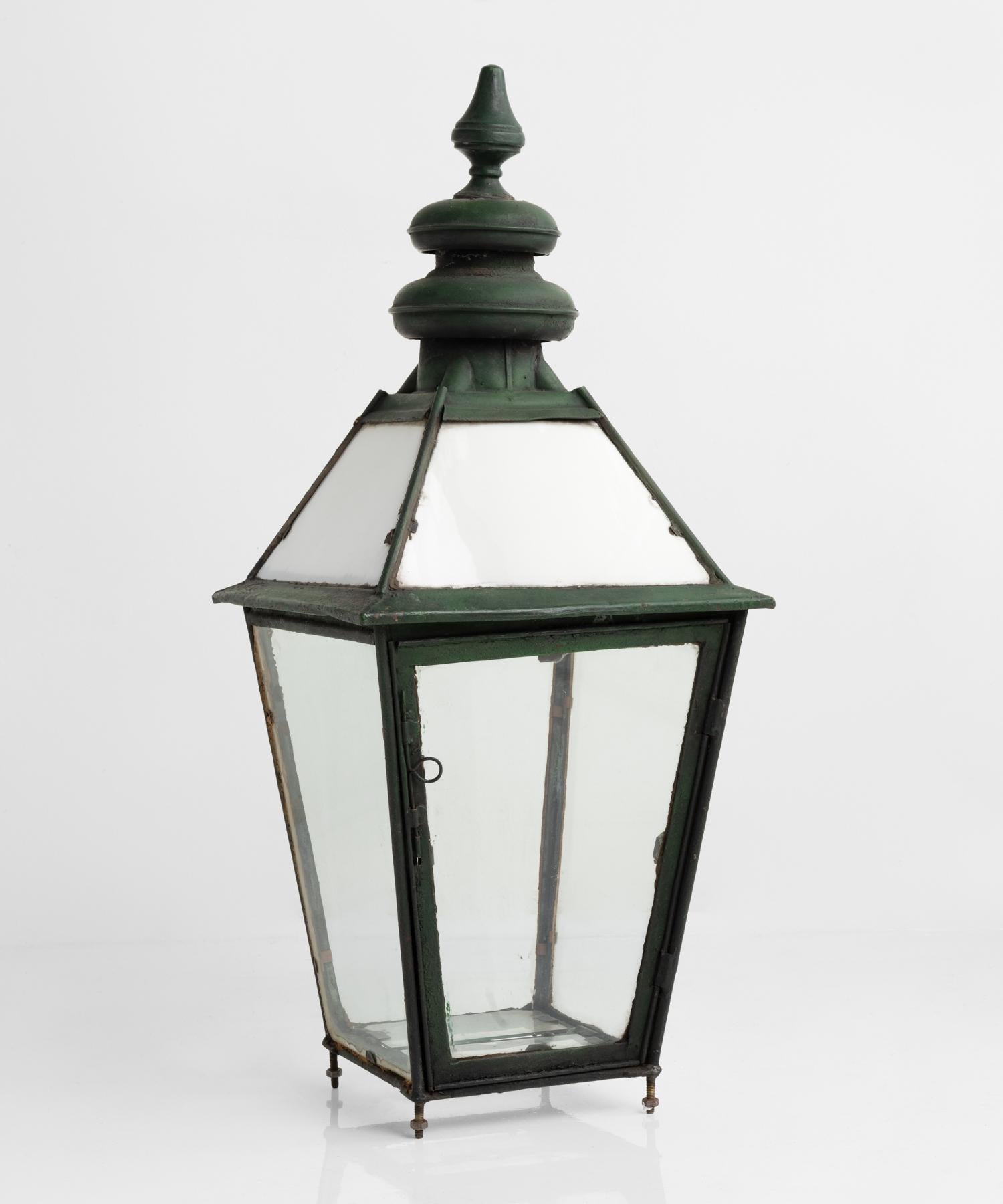 Copper and milk glass lantern, England, circa 1870.

Tall verdigris copper lantern with original milk glass panels in the top section, and clear glass beneath.