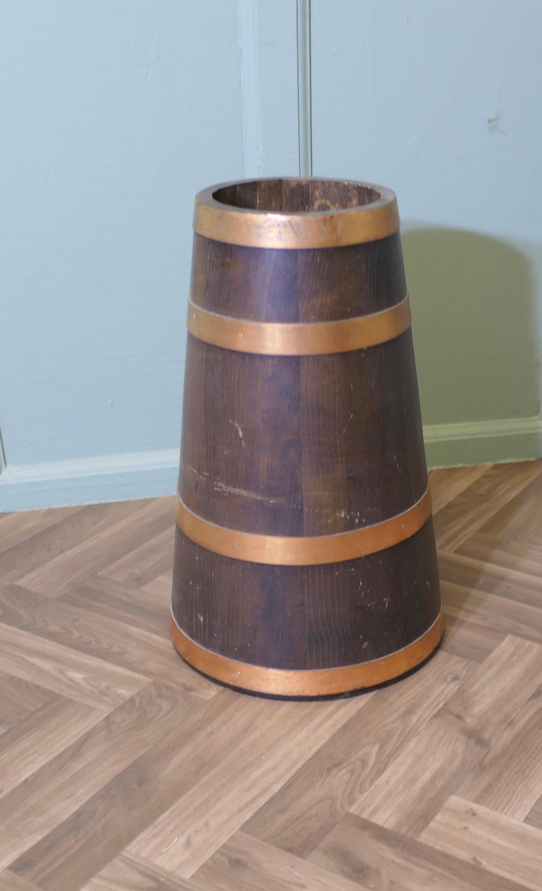 Copper and Oak Barrel Stick Stand  This  good looking piece is cone shaped In Good Condition For Sale In Godshill, Isle of Wight
