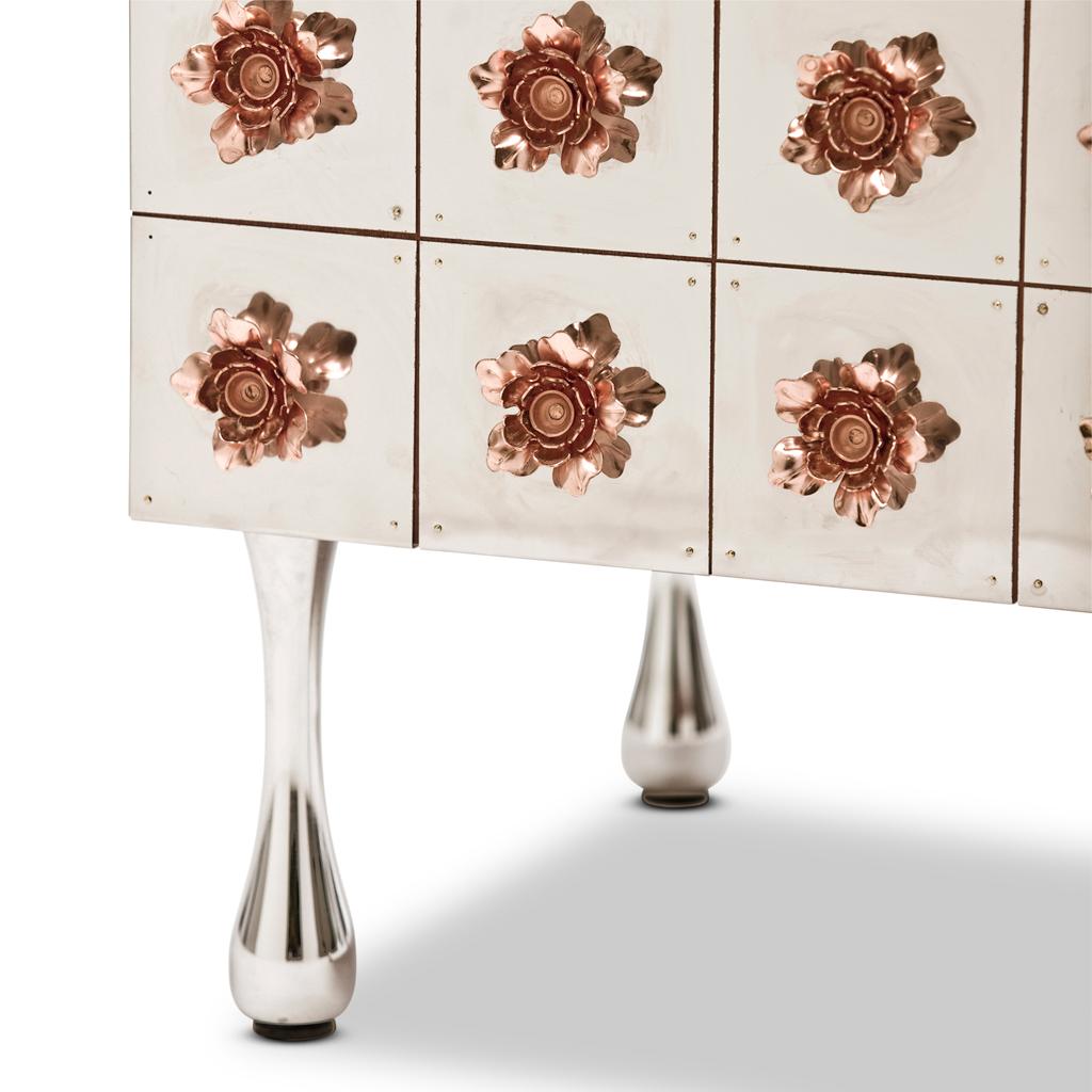 The Rosette Drinks cabinet belongs to the Rosette collection designed by Egg Designs and manufactured in South Africa.
This high end, contemporary and bespoke cocktail cabinet is covered with a riot of copper steel flowers, these flowers surround