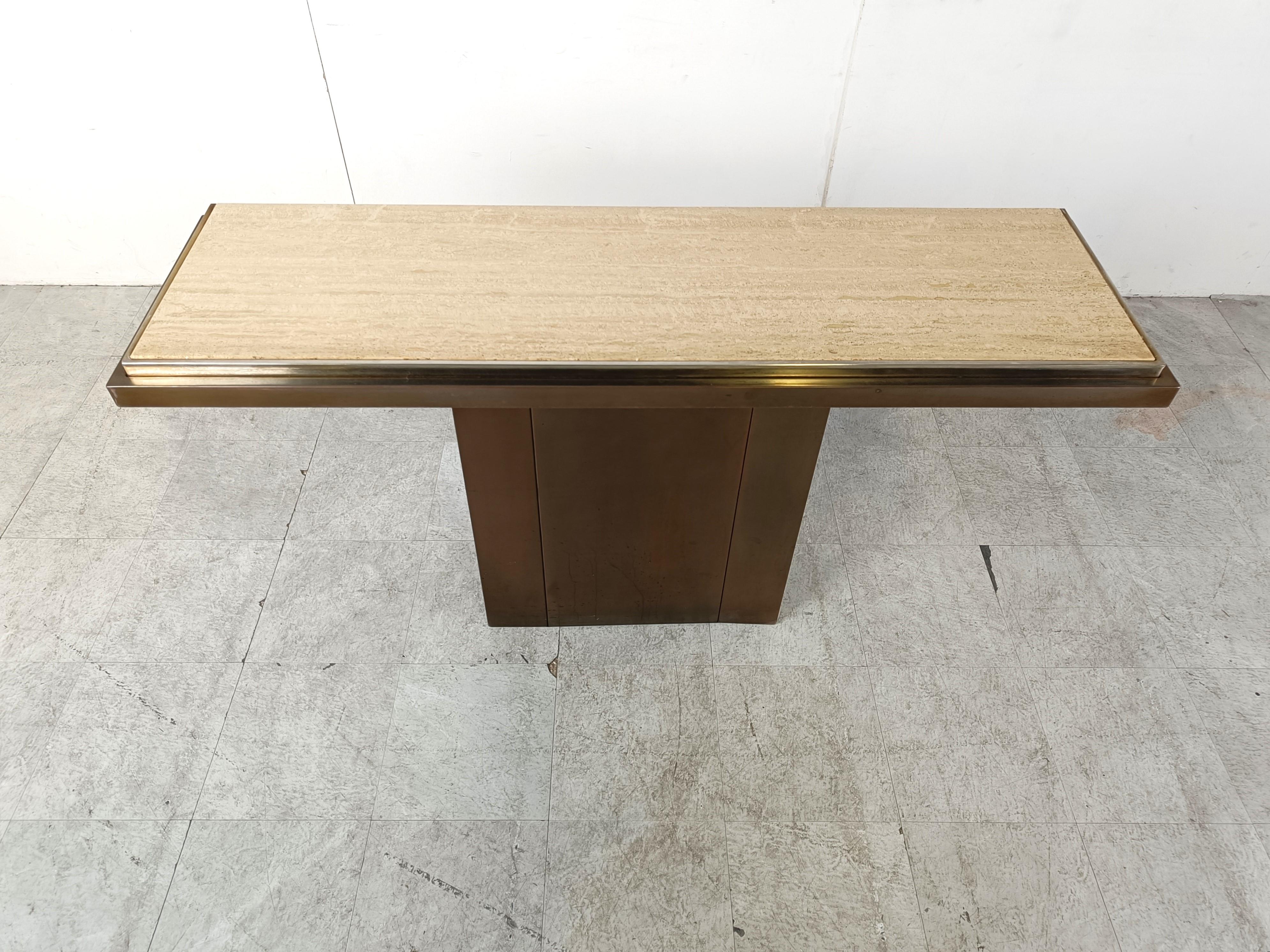 Copper and travertine console table by Belgochrom.

Timeless and decorative piece with a copper plated base/frame and a brass edge holding a travertine table top.

1970s - Belgium

Height: 80cm/31.49