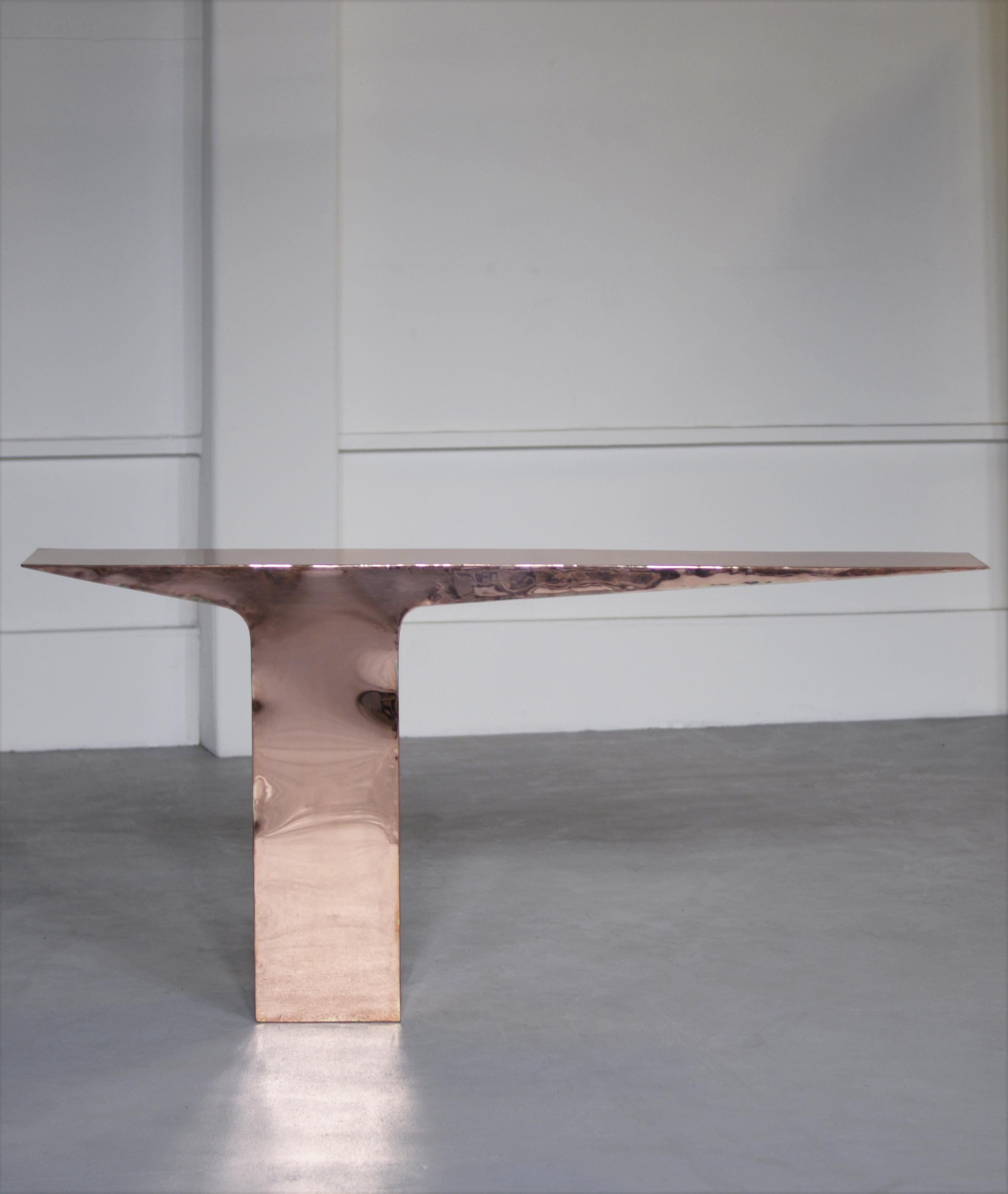 Copper Blade Console by Pol Quadens 
Limited Edition Of 8+4 Pieces.
Dimensions: D 30 x W 210 x H 95 cm.
Materials: Polished red copper.

Pol Quadens was born in Brussels. His father was active in the fields of composites the metal industry, and the