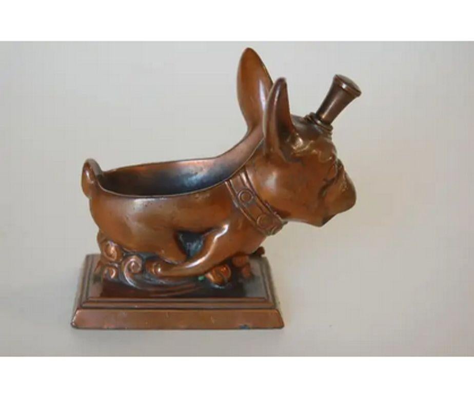 This rare, striker table lighter, in the shape of a running French Bulldog, is also a pipe holder. It was created in 1937, by the Ronson Company, and it is featured in 