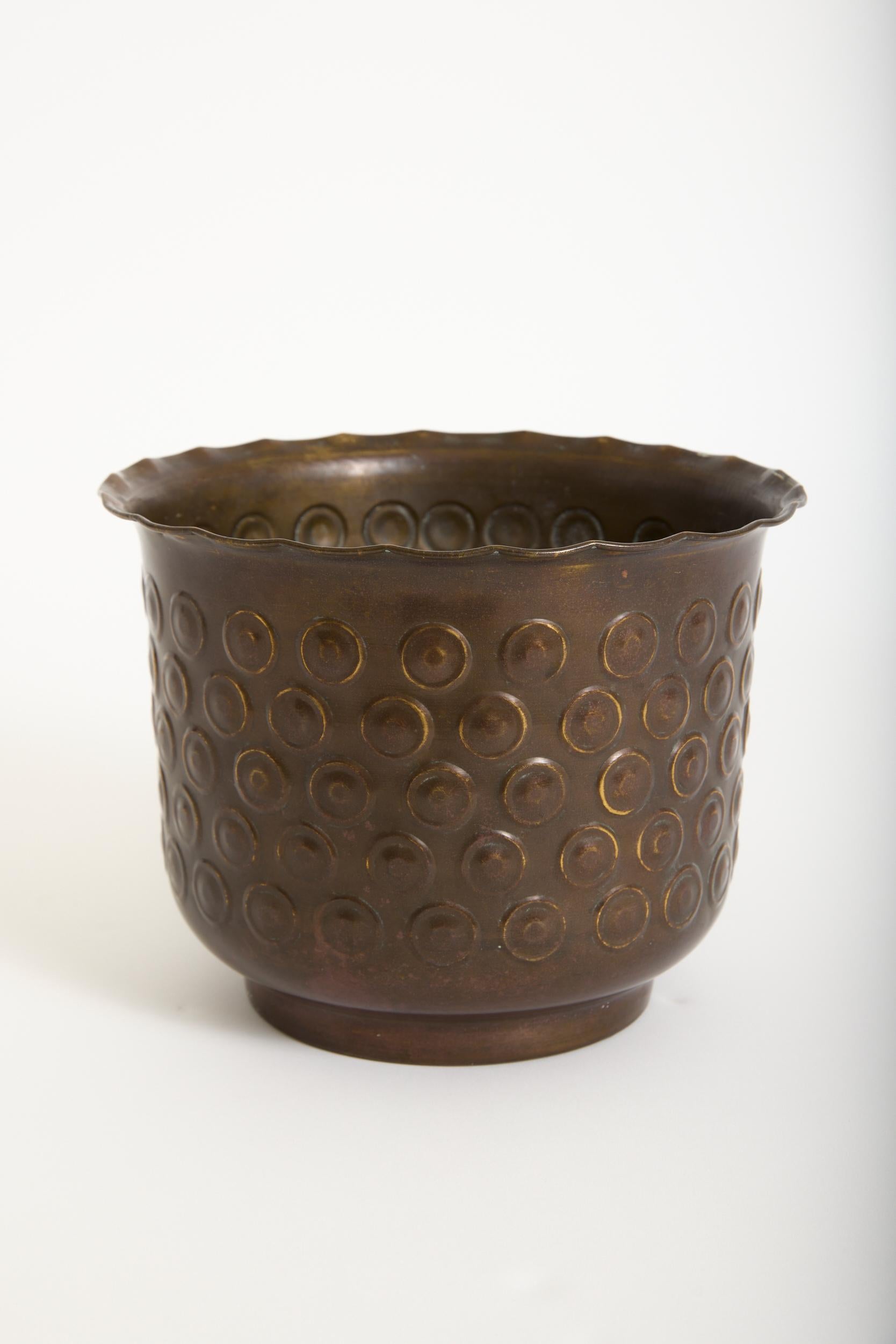 A repoussé copper cache pot
France, mid 20th Century
