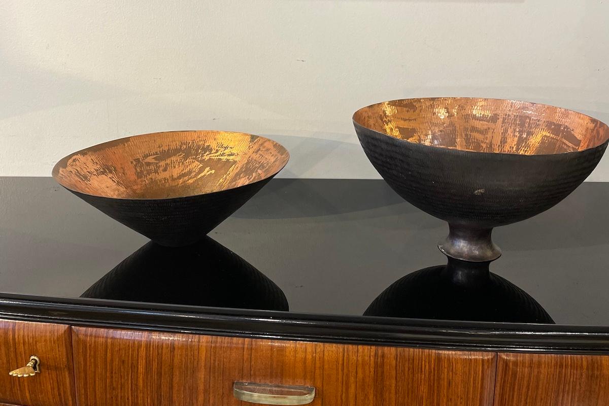 Pair of copper cache-pot vases, Italian manufacture, 1950s, made in the province of Padua
The vases feature an elegant conical shape: the exterior is finished in black, while the interior retains the characteristic warm color of copper
Two pieces