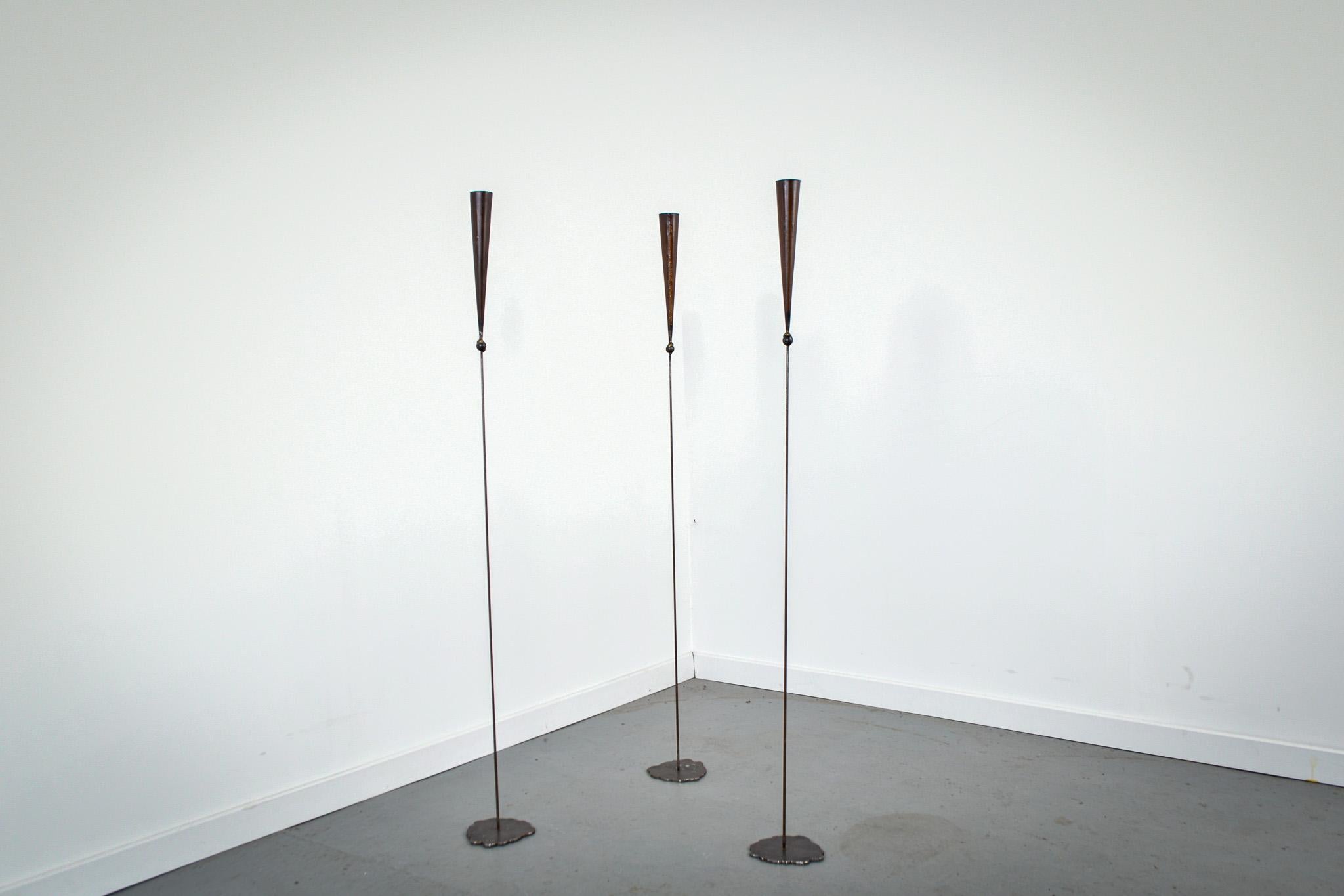 Set of three free standing candle holders. 

Handmade by Pieter Spruyt in the 1980s they are eache signed on the foot.

Very decorative with a brutalist look. Made from copper and very eye catching.
