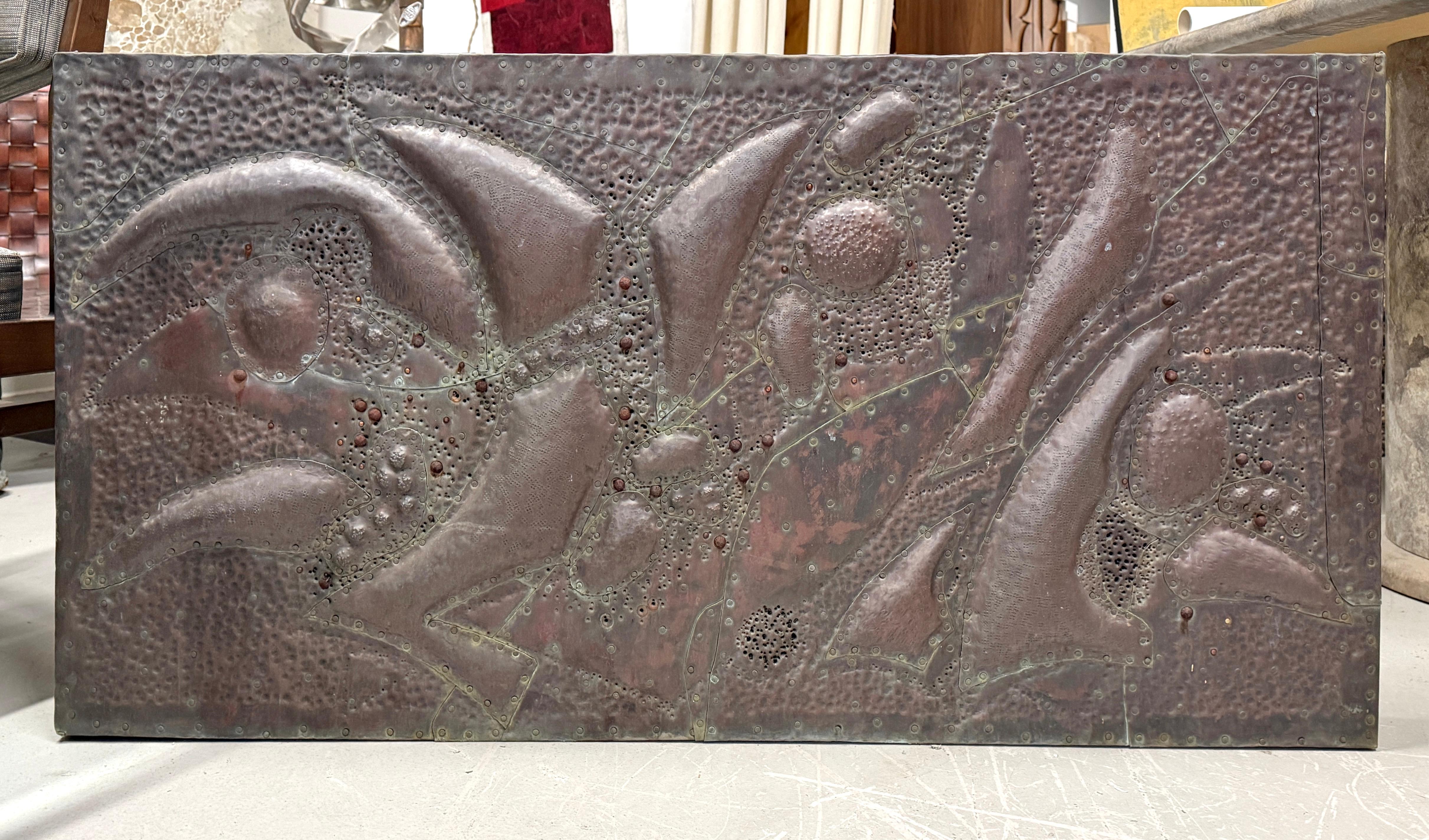 We were fortunate to acquire a few pieces of the late noted Palm Springs artist Bill Anson. He was a former NASA engineer who turned to art later in life. This unsigned work is in his signature style, copper fish scale shaped pieces hand hammered