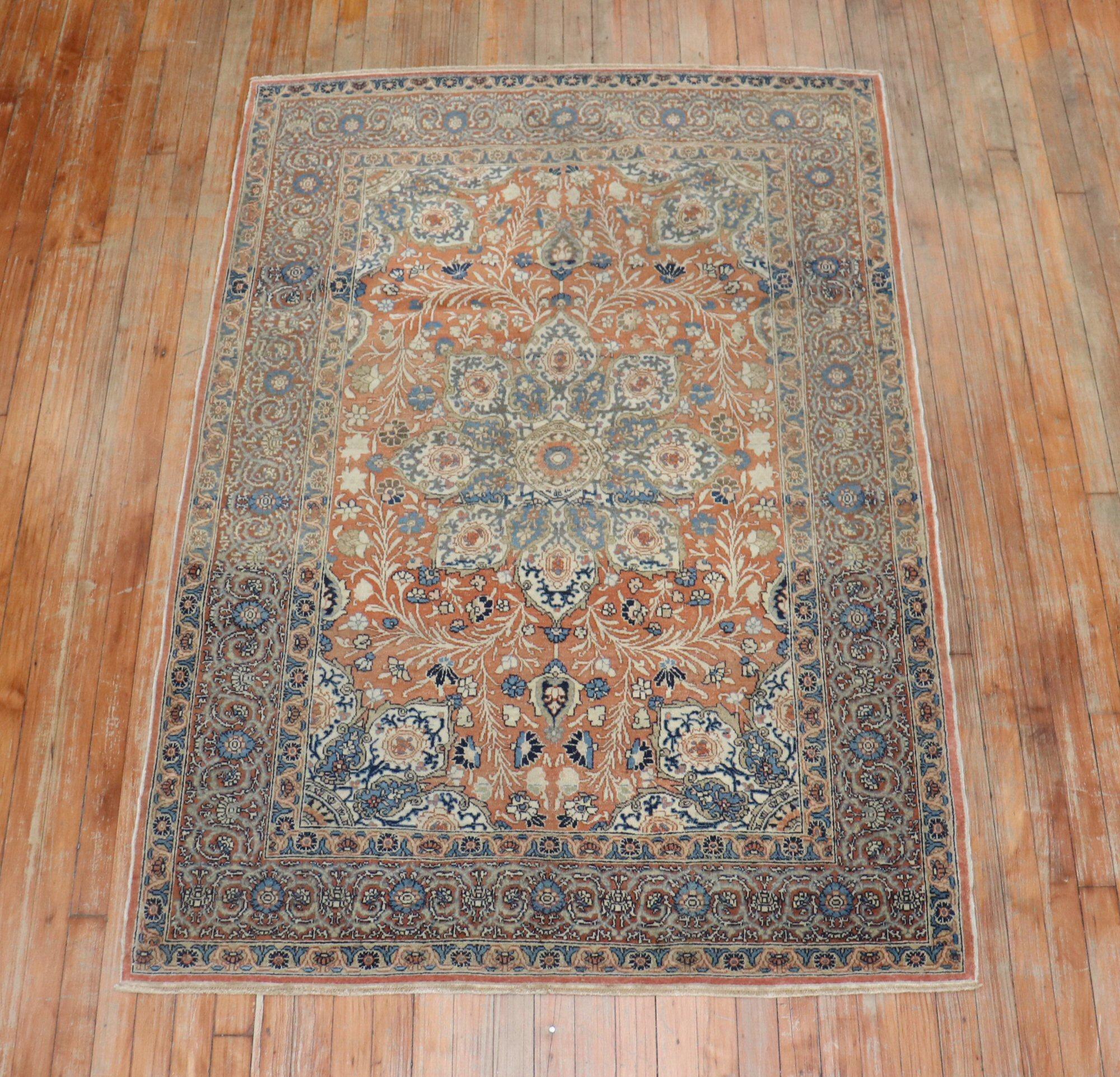 Classic Persian Tabriz rug with a copper color ground, accents in brown and blue.

Measures: 4'1