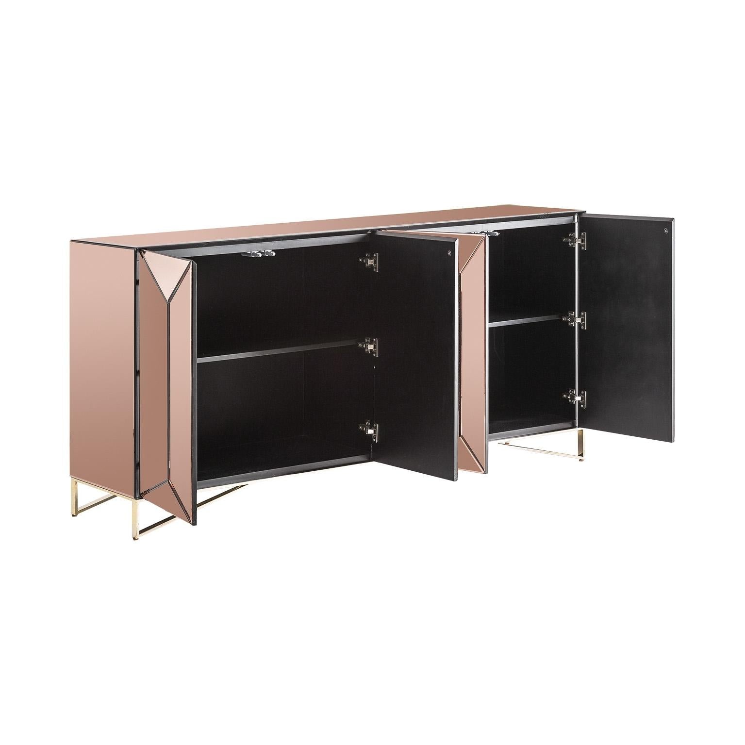 Sparkling and sophisticated mirror sideboard with chrome feet and four copper mirrored doors that open on shelves.