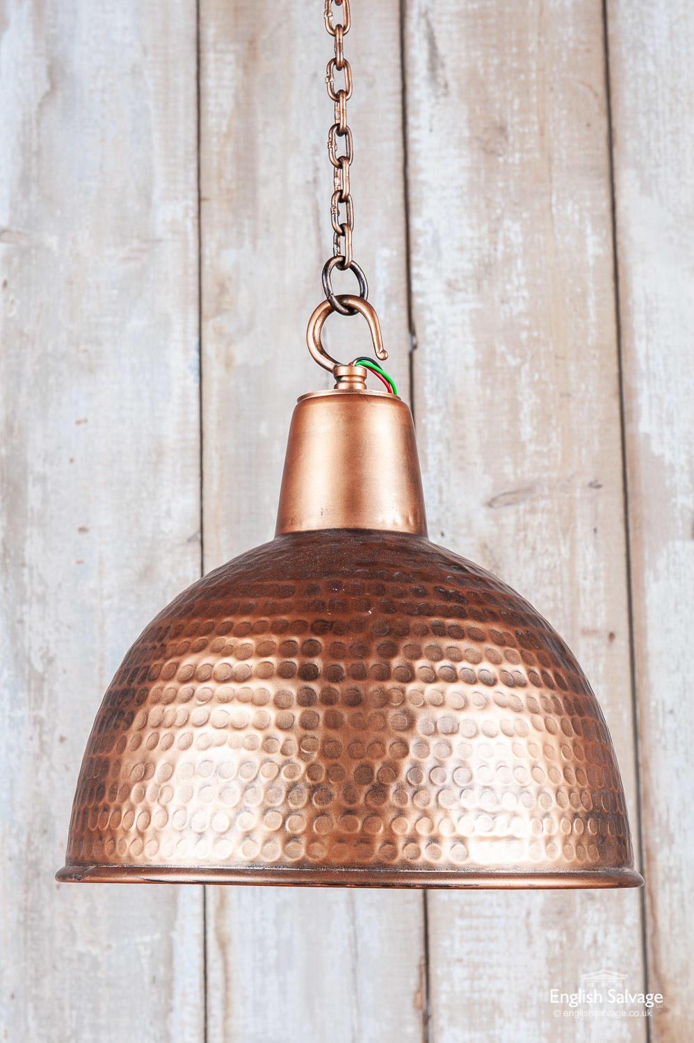 Copper colored aluminium ceiling light with attractive hammered dimpled finish. The inside of the shade is an attractive bright copper color. It is wired to take a small Edison [screw-in] bulb, and comes complete with chain and ceiling rose.
