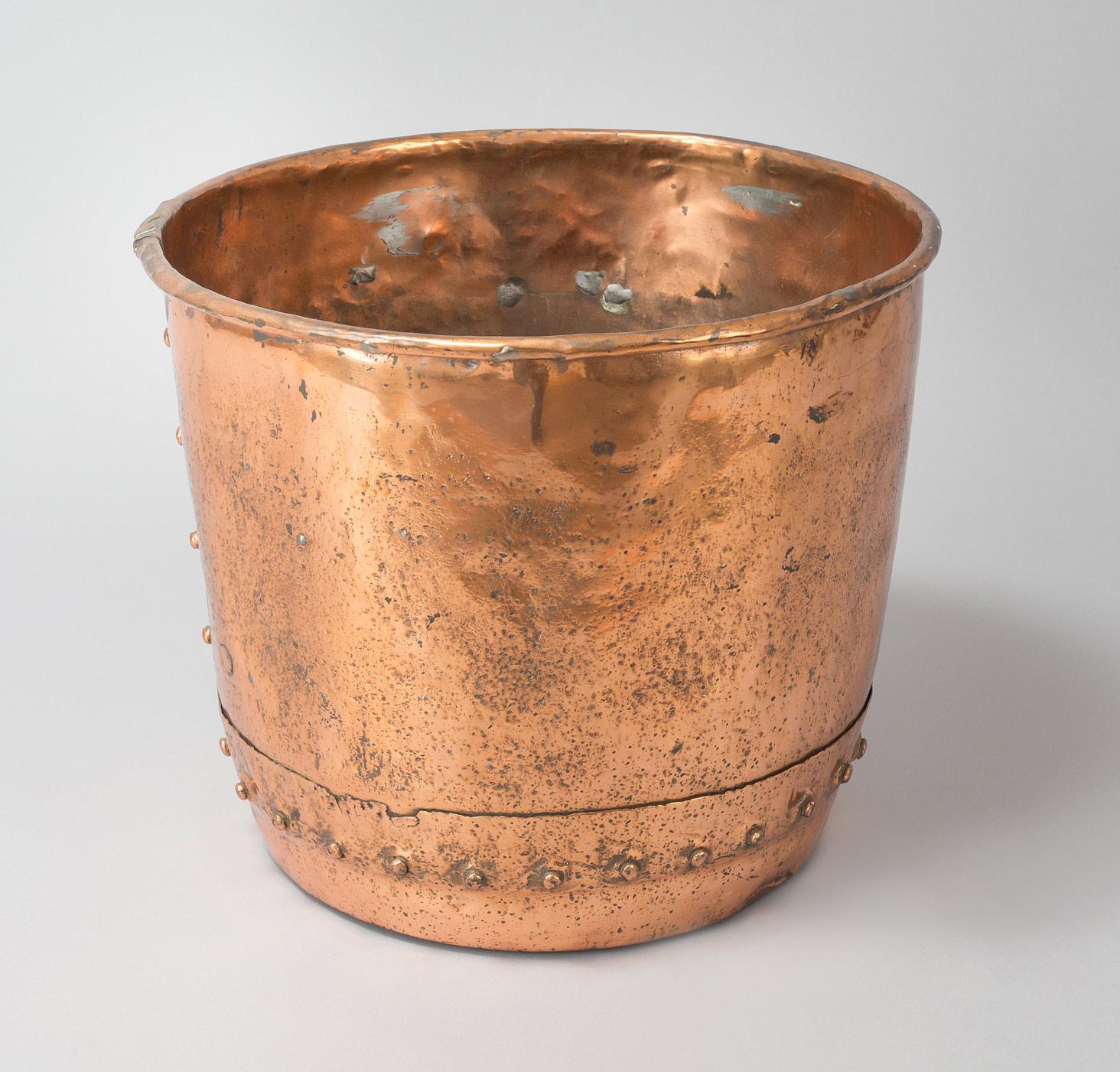 Copper “copper” planter with riveted seams and peened over rim. Also great for storing kindling wood at the fireplace. Originally these coppers were used for boiling water.