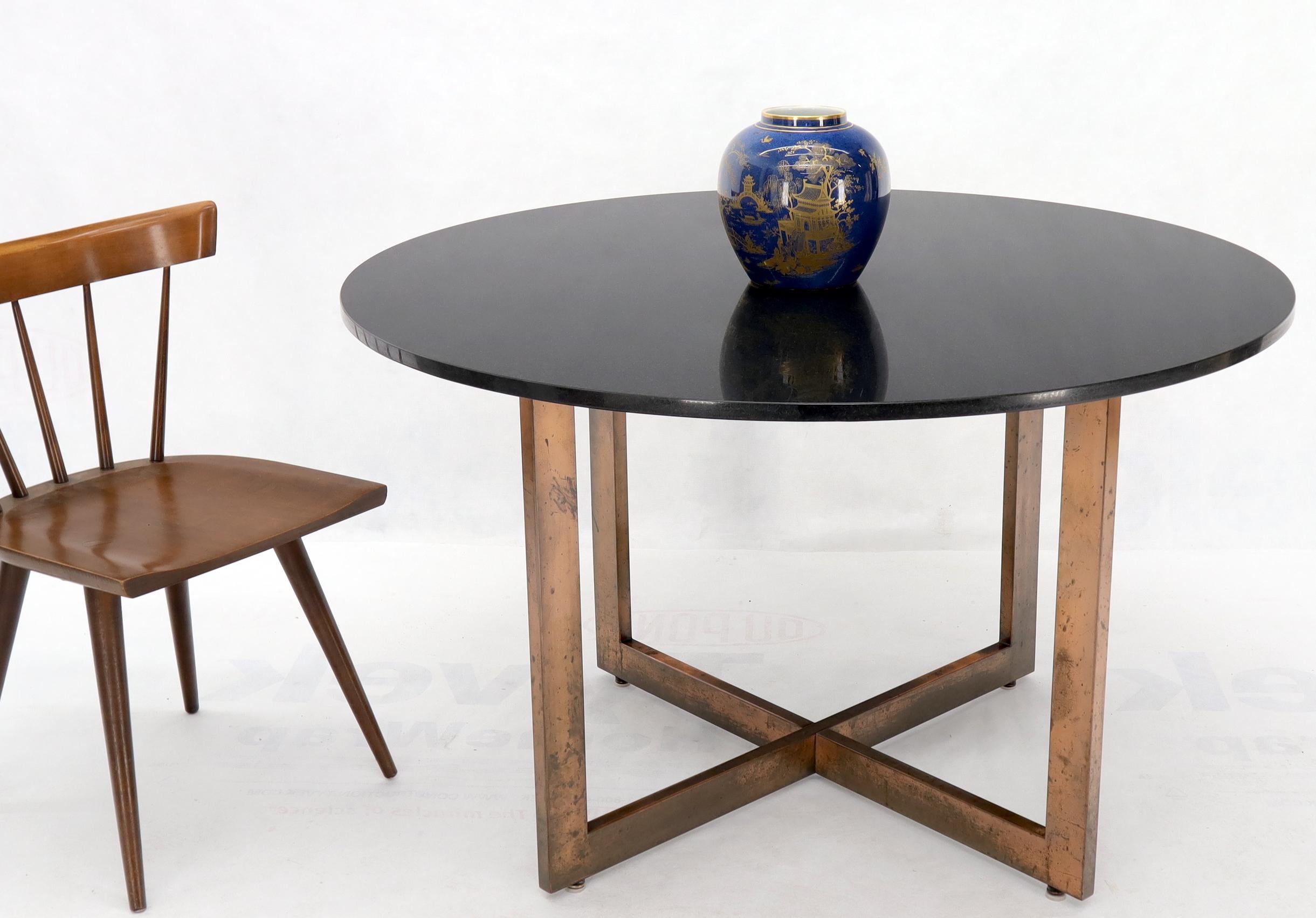 Mid-Century Modern copper finish metal cross base table with this granite top. Measures: 48