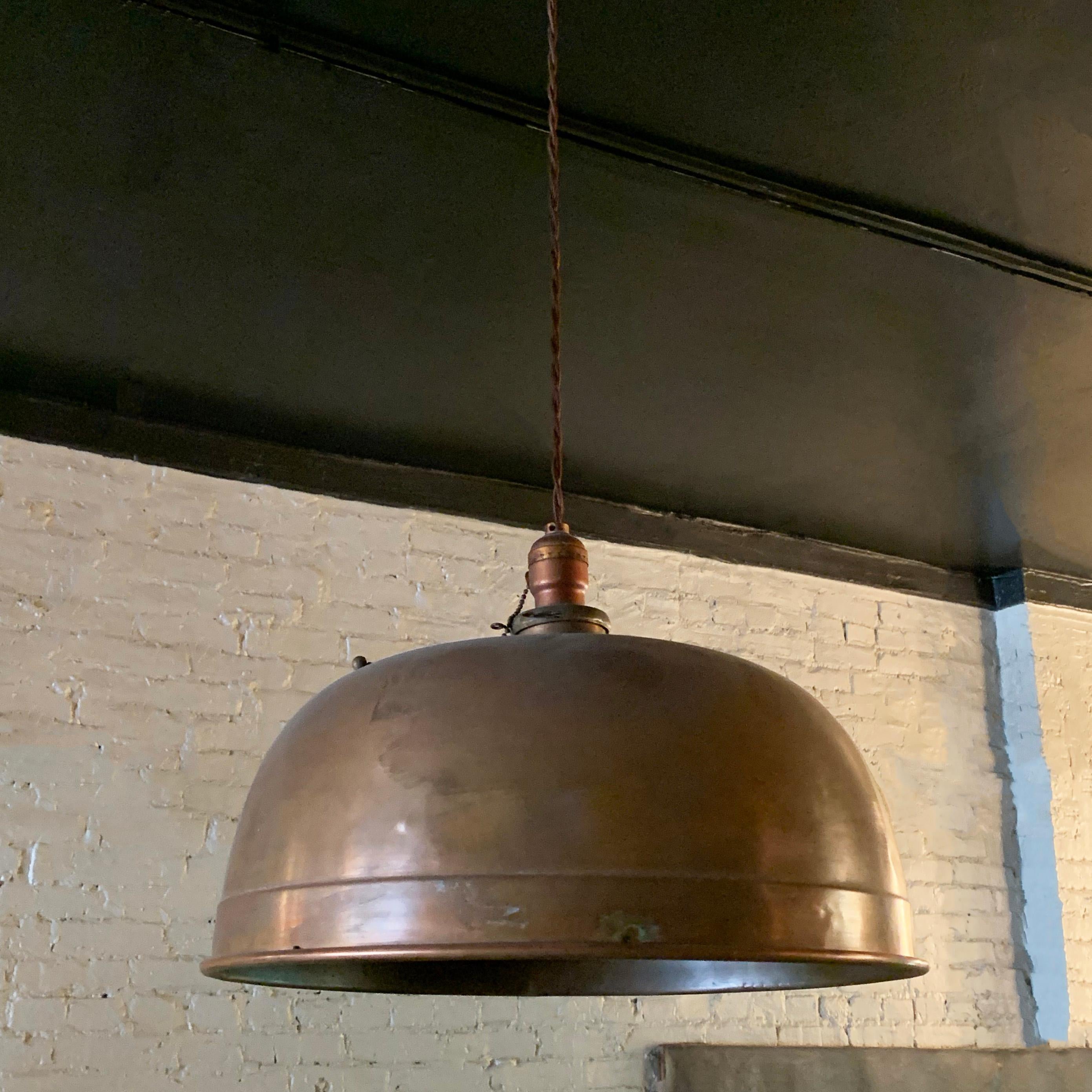 Billiard pendant light by Brunswick Co. features a copper dome shade with brass fitter, newly wired with 40 inches of braided cloth cord to accept up to a 200 watt bulb.