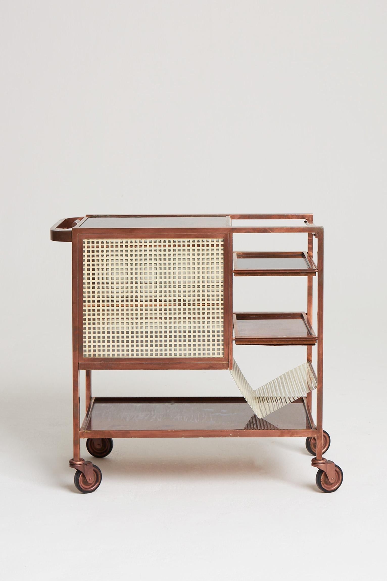 A copper plated and églomisé mirror glass drinks trolley, attributed to Joseph Hoffman (1870-1956).
Austria, Circa 1905.
 