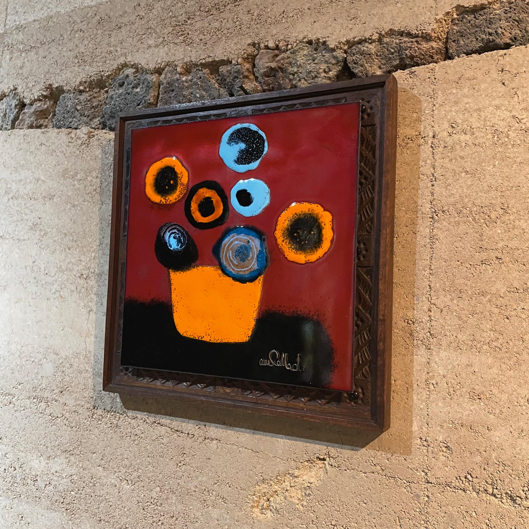 Enamel on copper art. Wood carved frame. Signed lower right corner. Callado. Bright colors. 
Still life flowers in a vase.
Colorful orange blue red.
Measures: 12.5 H x 12.5 H x 1.25 D inches
Unrestored vintage preowned very good