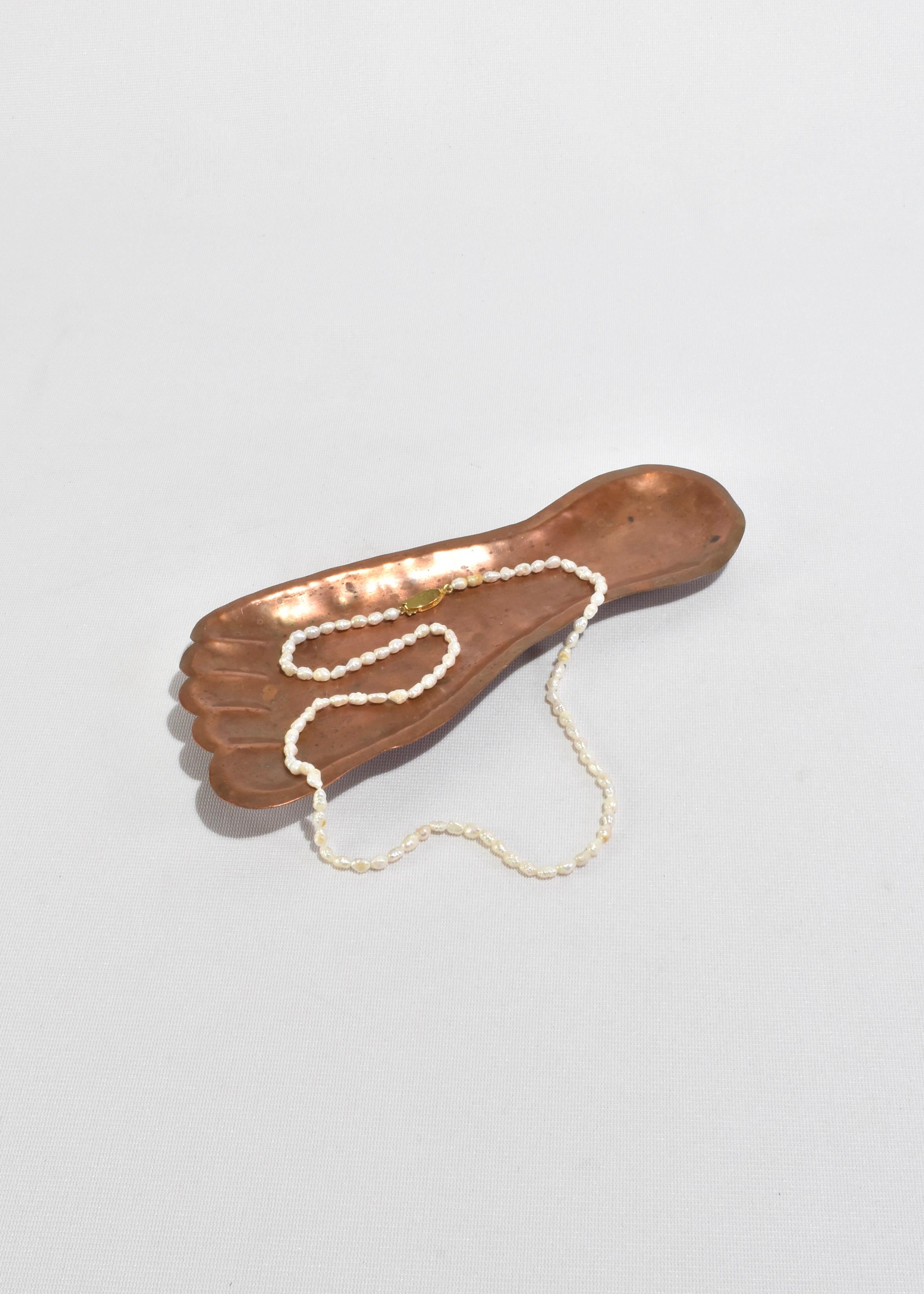 Vintage, copper catchall or ashtray in the shape of a foot.


