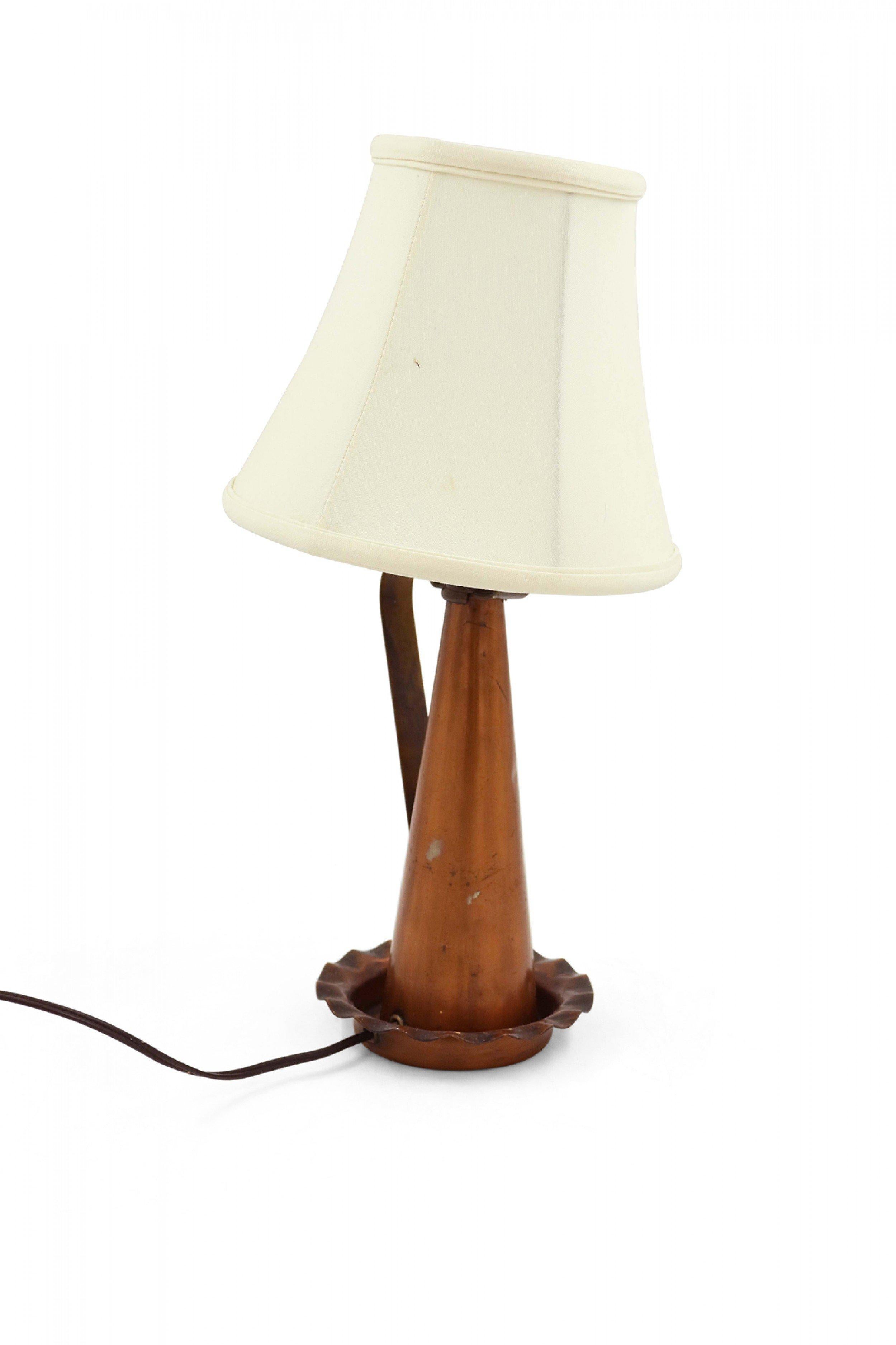 American Country style copper funnel table lamp with scalloped base and brass handle.
 