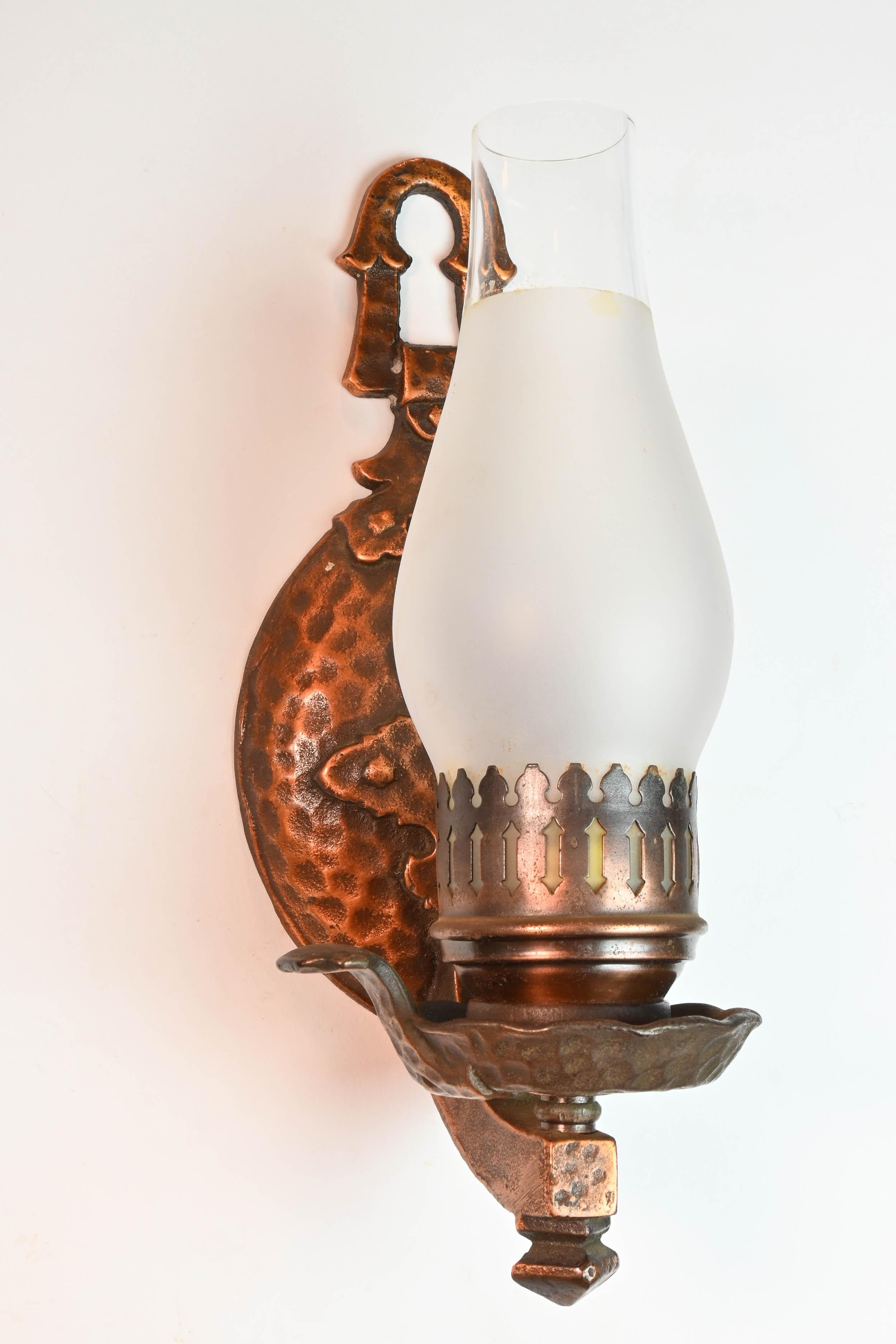 Lovely lamp-like sconces in a hammered copper finish. The little hat can be removed if desired. 

Illumination: One Edison socket
Dimensions: 11” height x 4 1/4” width x 4 1/2” projection

We find that early antique lighting was designed as