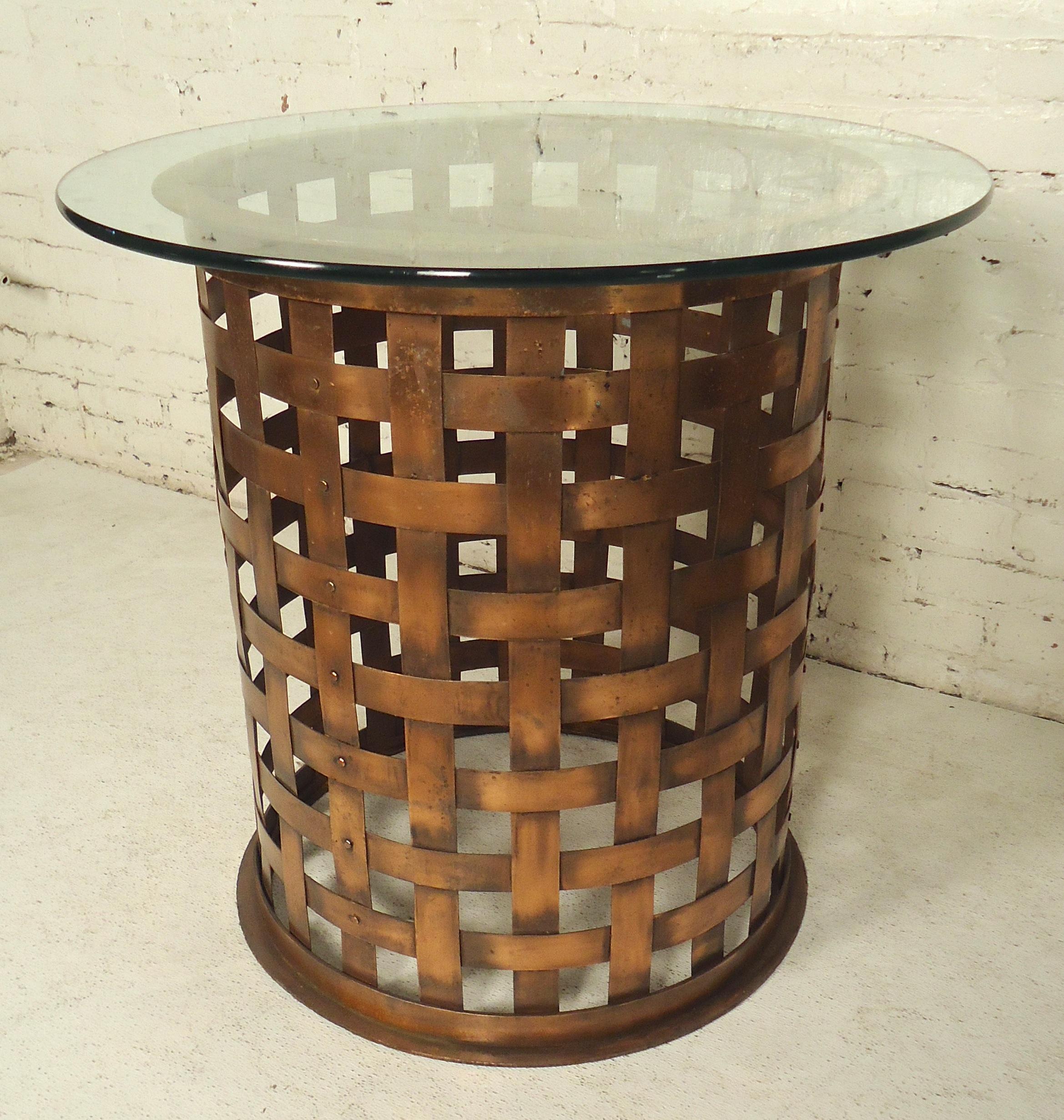 Lovely woven copper table with round glass top. Can be used as a pedestal table or dining table with larger glass.
Ask about larger glass top

(Please confirm item location - NY or NJ - with dealer).
 