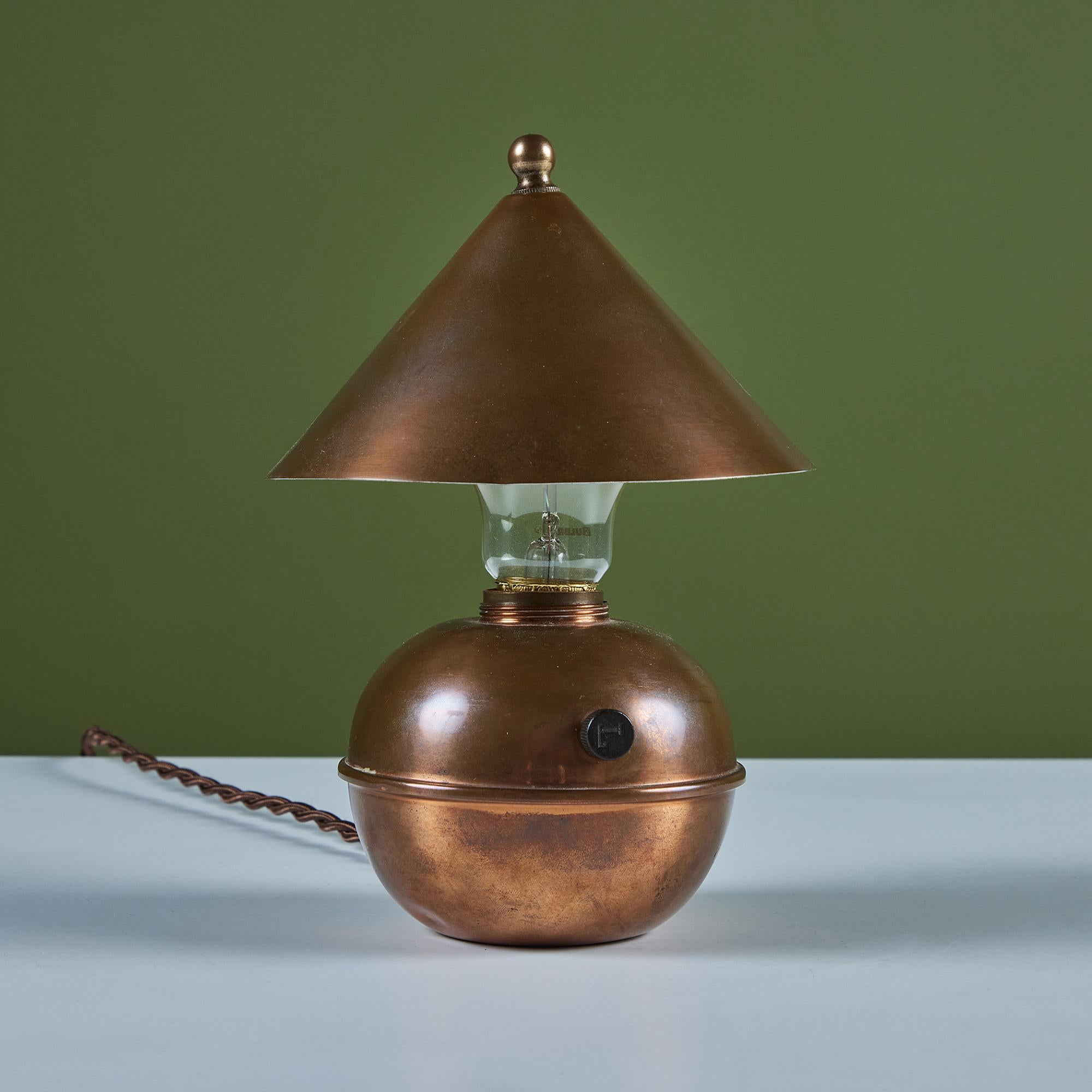 Petite copper table lamp by Ruth Gerth for Chase, c.1930s, USA. The Art Deco lamp features a cone shaped shade and bulb body in patinated copper. The minimalist design is playful and a fun piece to add to a shelf or desk.

Impressed with [Chase] and