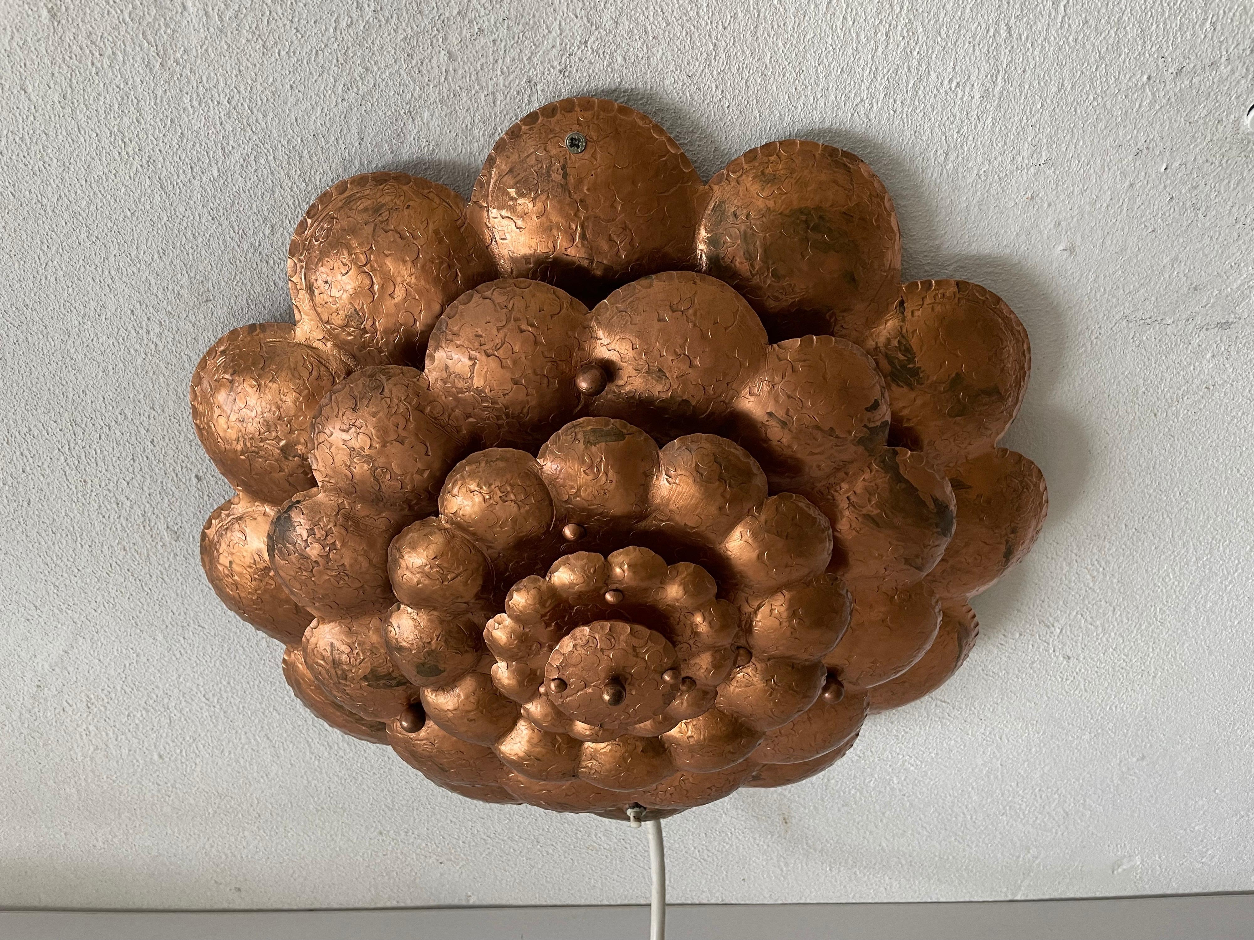 Copper handcrafted metal flower shaped single sconce or flush mount ceiling, 1950s Germany

Sculptural very elegant rare heavy ceiling lamp flush mount 
Heavy product
Switch on/off button on the shade.

It is very ideal and suitable for all