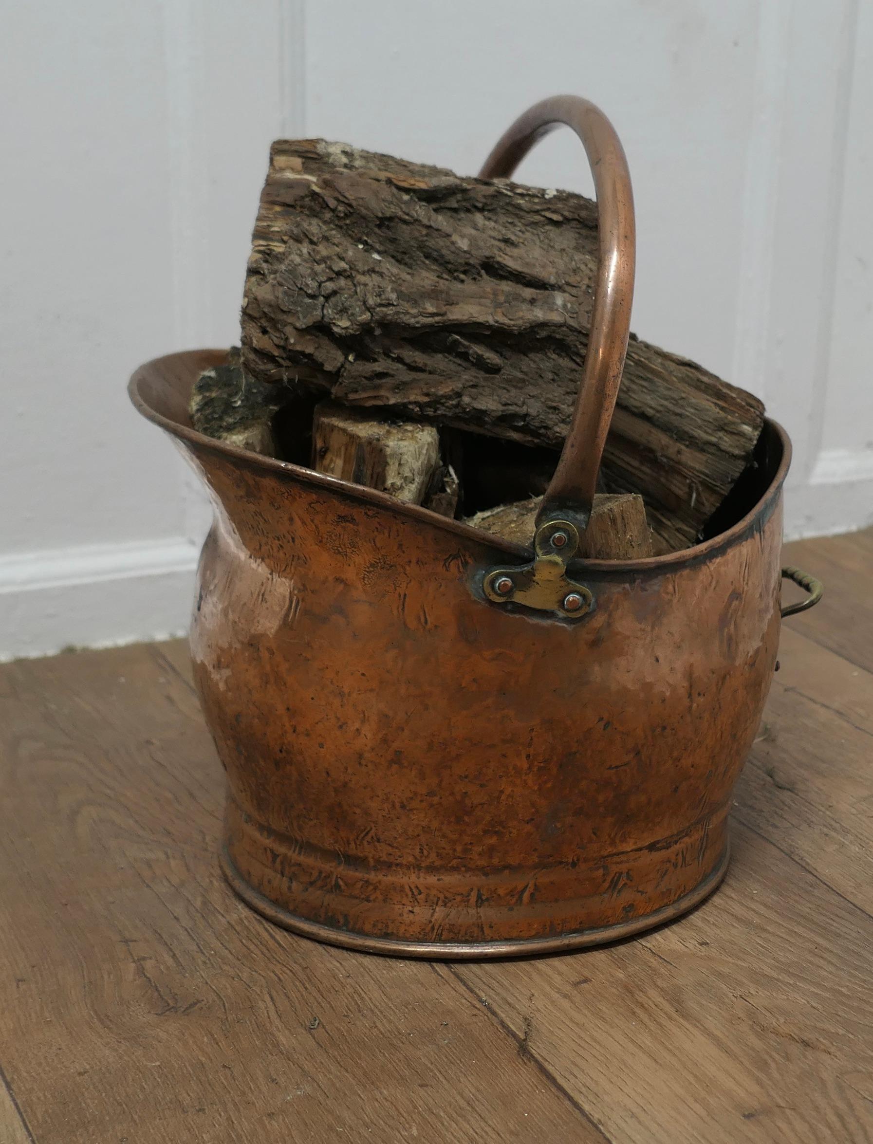 Early 20th Century Copper Helmet Coal Scuttle   This bucket is a very attractive helmet shape  For Sale