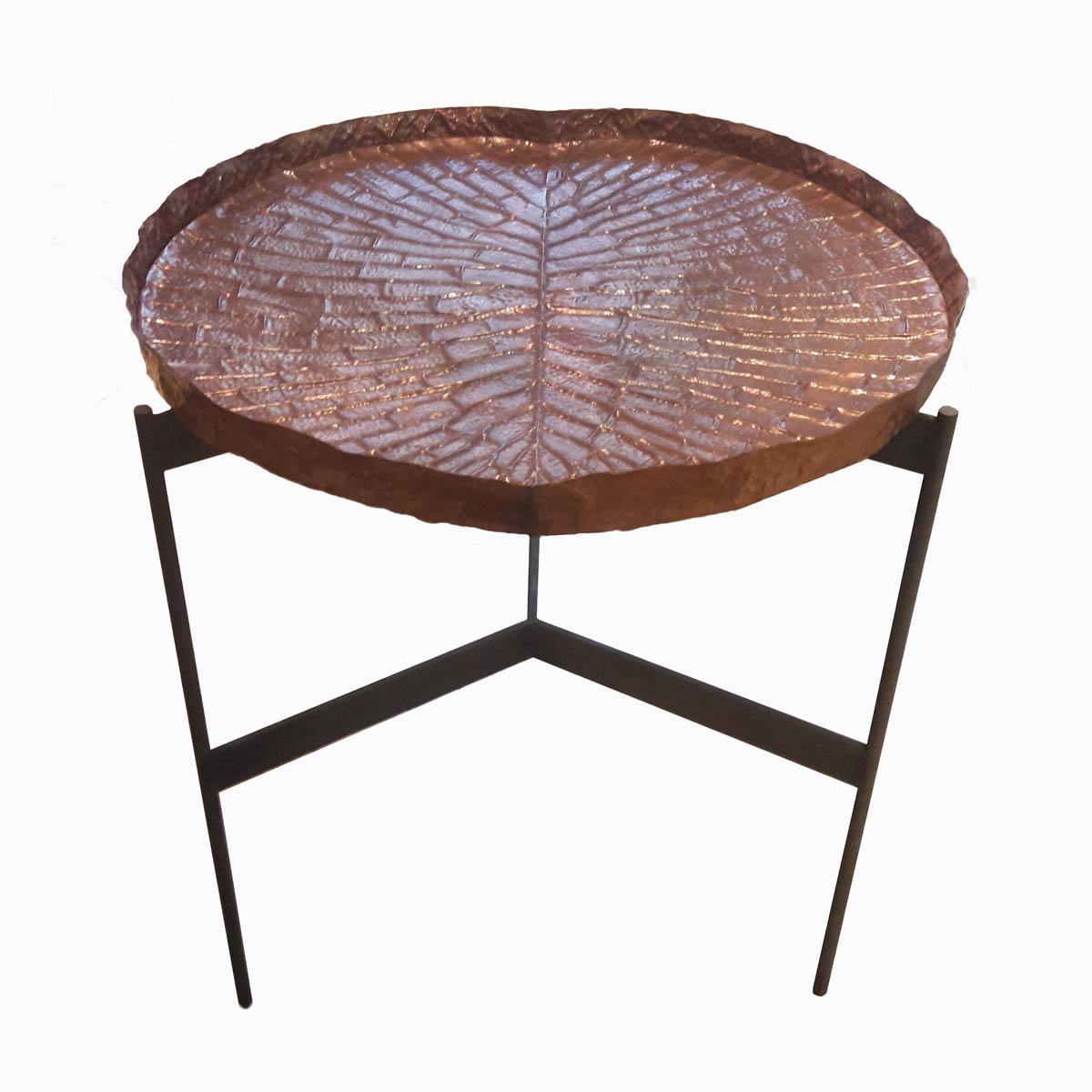 A high table with a repoussé copper tray resembling a lily leaf, on top of a wrought iron base. From Indonesia. Its unique looks and sleek, stylized lines make this original table an eye-catching addition for a porch, a patio, or any other space for