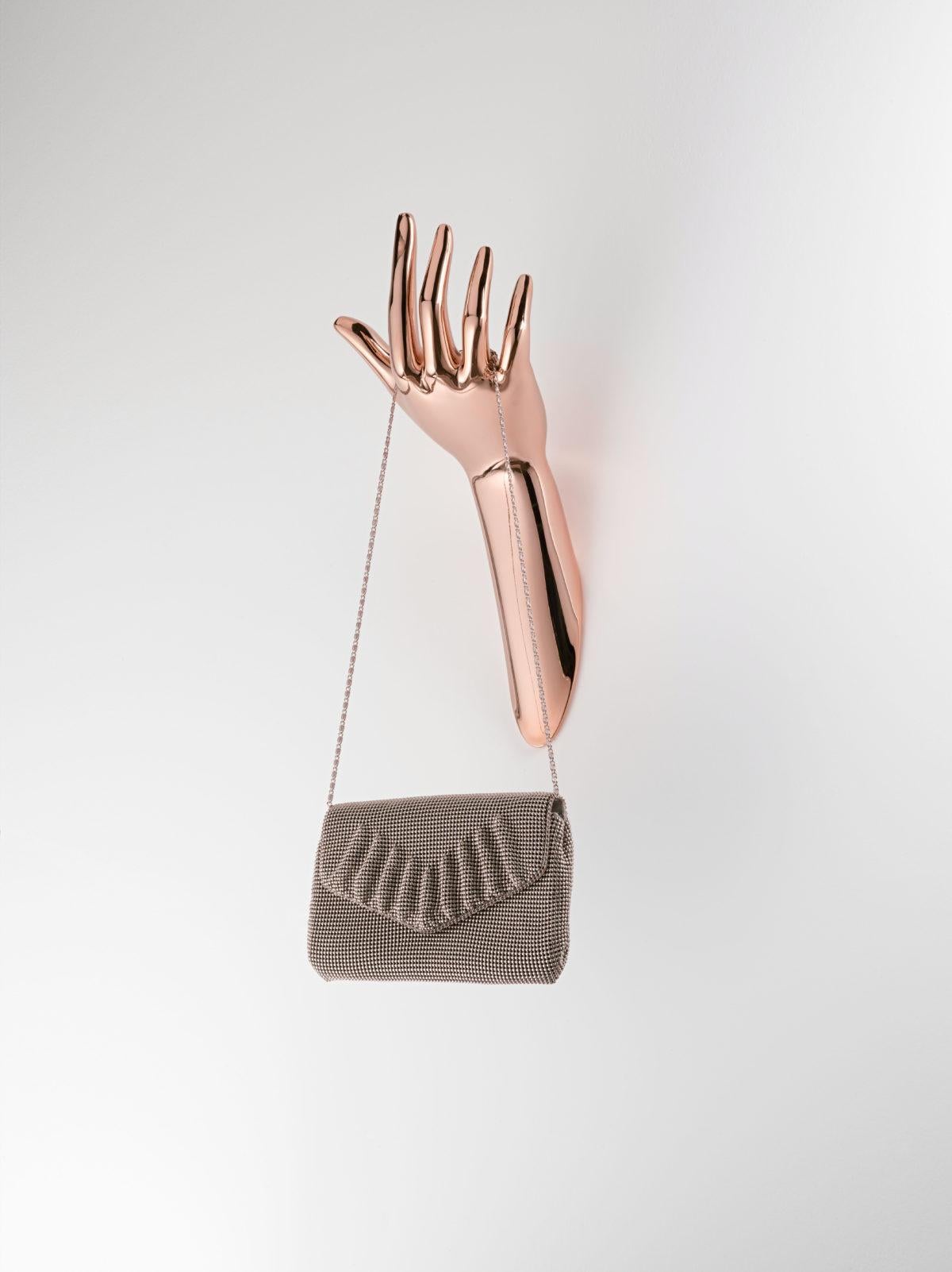 Copper Human Hanger by Aggiolight
Dimensions: D 22 x W 15 x H 39 cm. 
Materials: Copper-plated metal.

Available in chrome, copper, gold, nickel, rose gold, antique bronze, antique brass, brass, black nickel, and stainless steel metal finishes.
