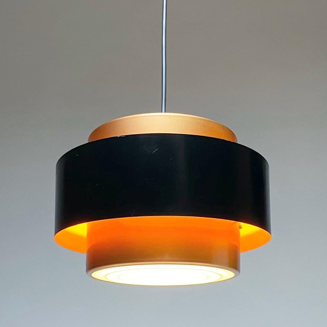 Throughout the world Danish designers are known for their craftmanship, functionality, high quality materials and iconic designs. 

This Mid-Century Modern and iconic copper ceiling light by Jo Hammerborg for Fog Morup, Denmark 1966 is no