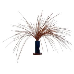 Escultura cinética de cobre "Zarza ardiente" de Jope