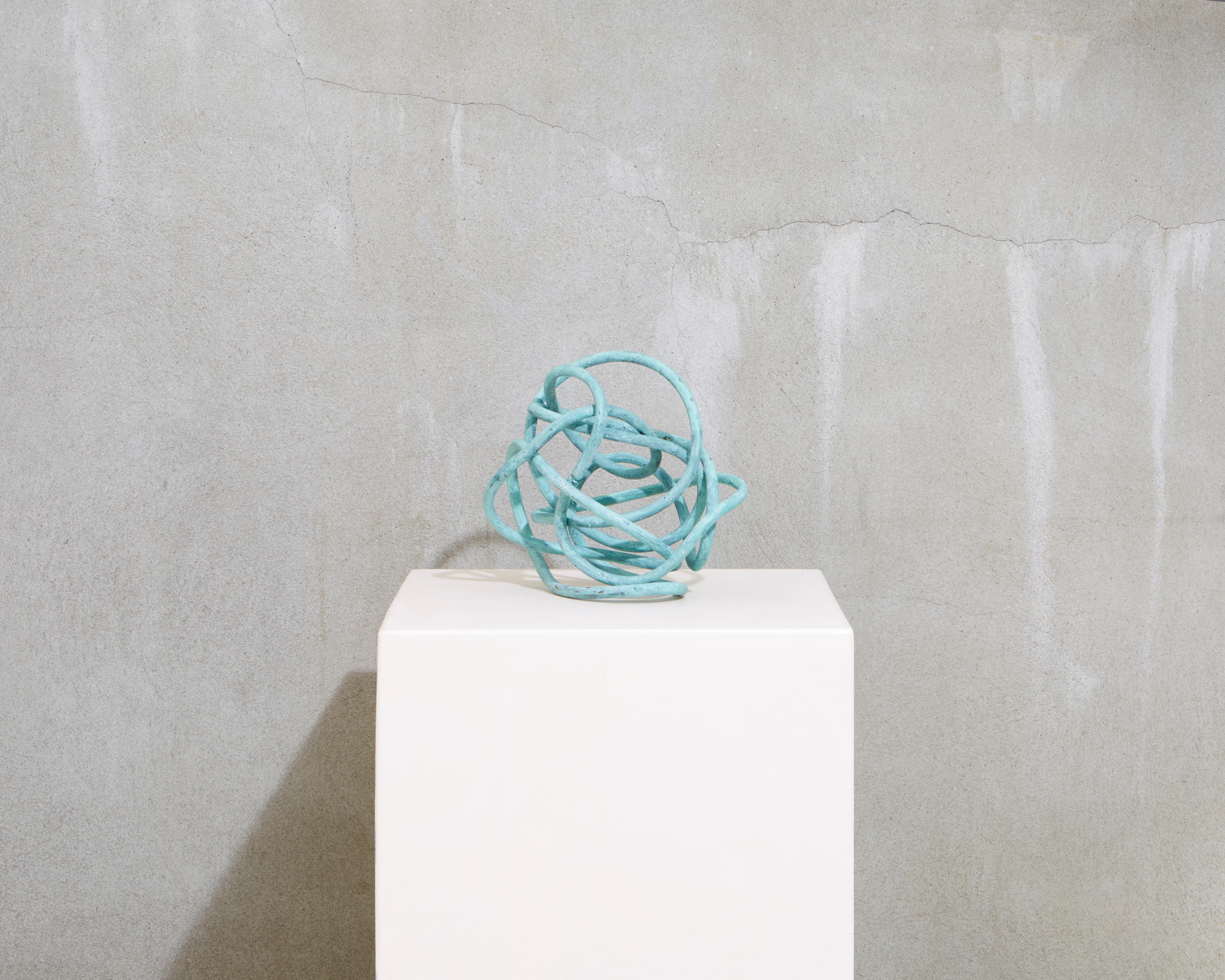 Bending and twisting this form contains the energy of the universe in an unending tangle of form that can exist on a shelf, plinth or most any surface.    
The Copper Knot is a decorative sculpture from the North Fork Collection at Studio Melrose.