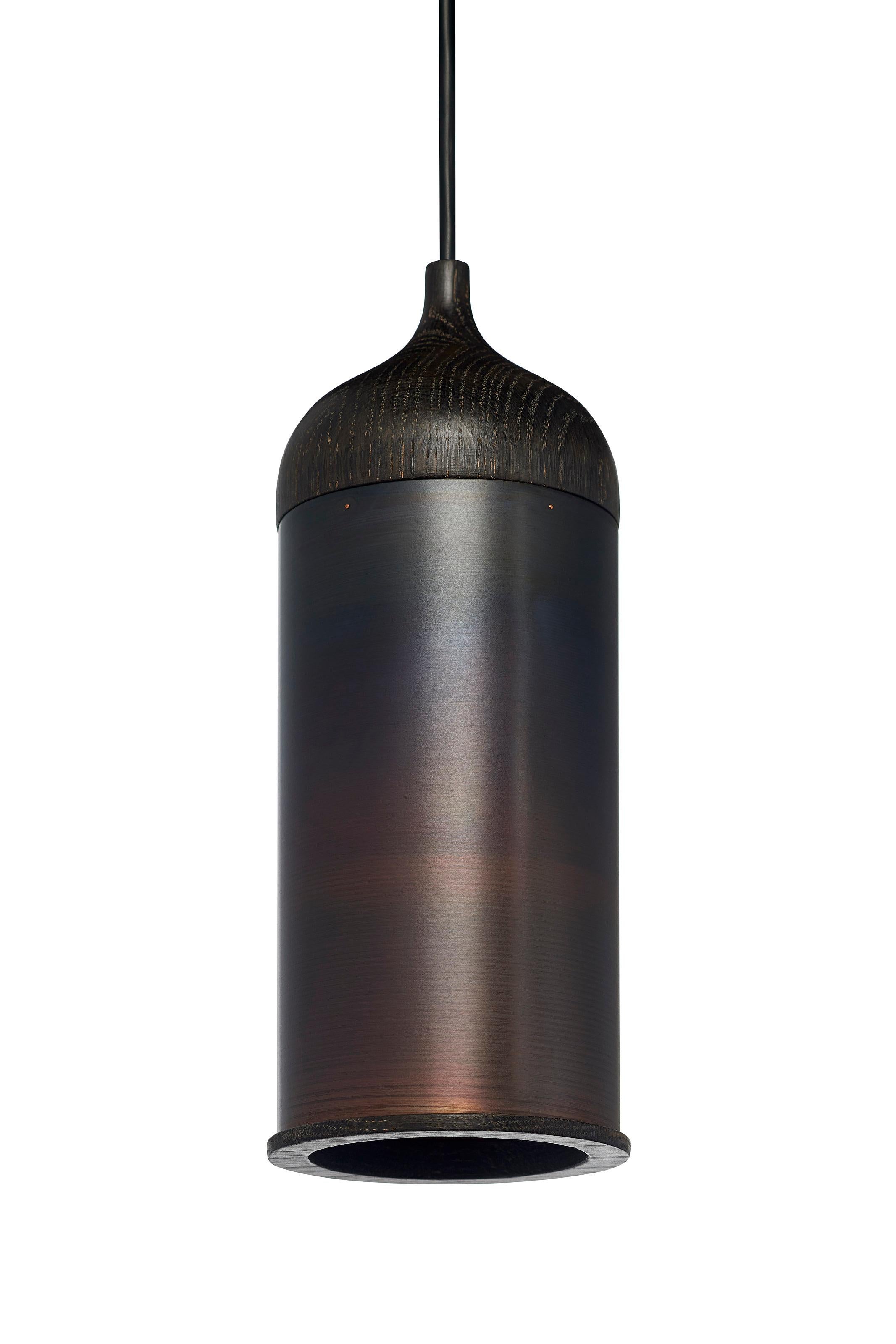 The black version of our well-known copper lamp. The copper is blackened with an acid which gives a natural black color with copper undertone. 

A cool led light reflects inside the copper pendant lamp. It creates a clear light center which is