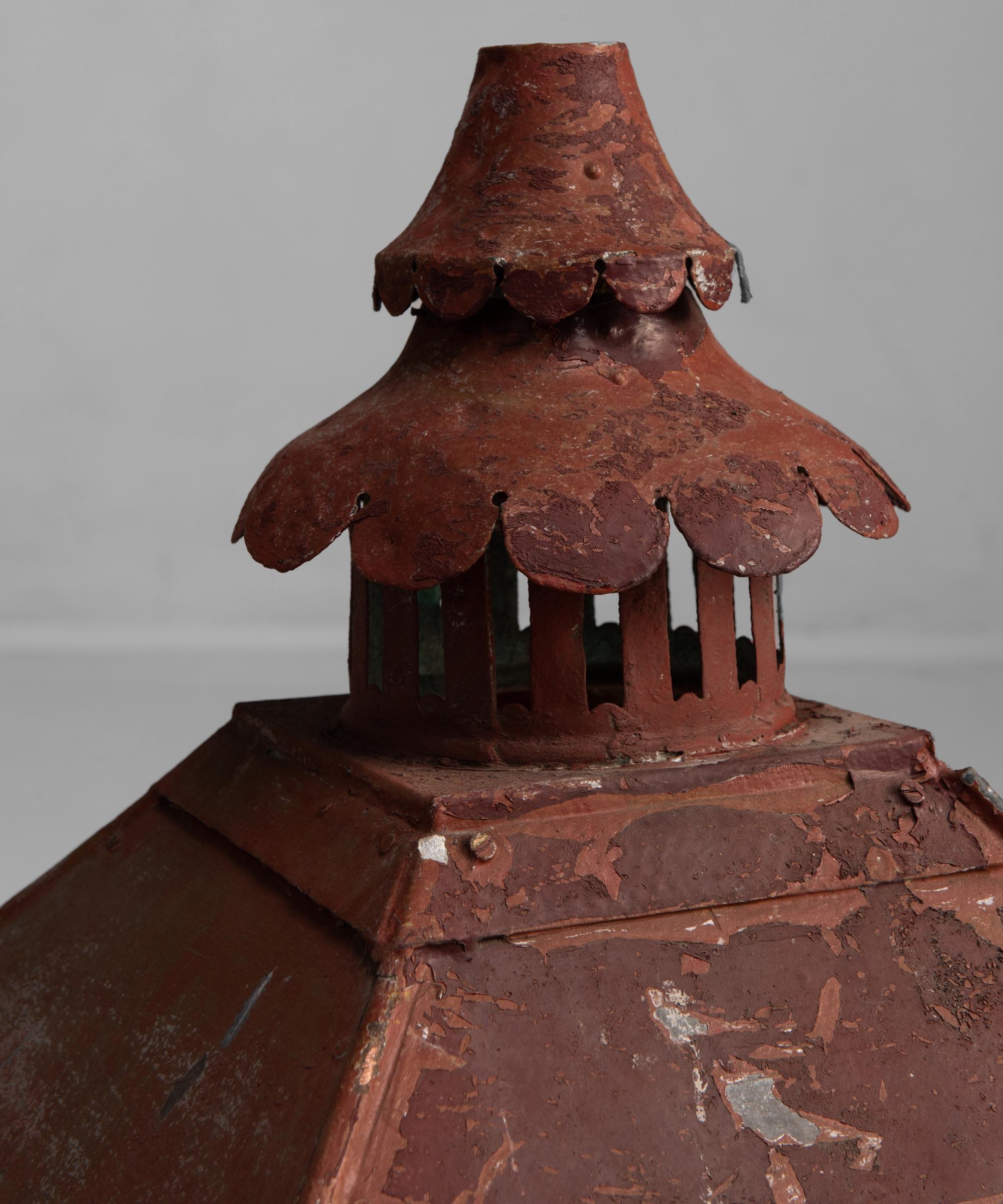 Copper lantern with ornate corners, decorative vented chimney and turned wood feet, all in original red finish.


Measures: 15.25