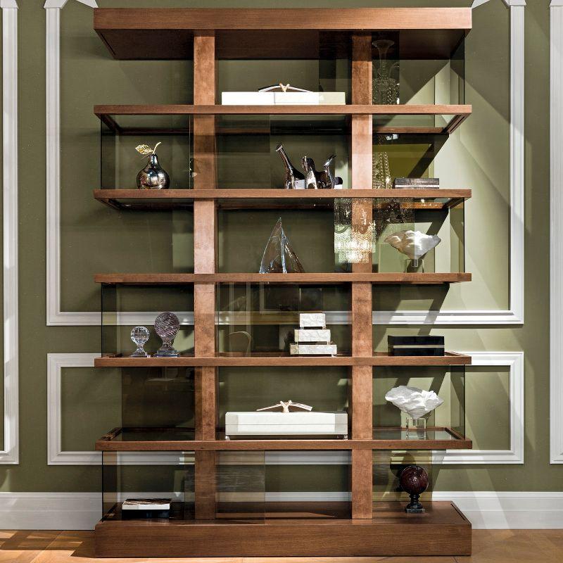 Boasting a superb design of striking modern allure, this bookcase will take center stage in a refined interior of any style inspiration. Fashioned of oxidized copper leaf, it features six shelves enriched with smokey glass slides. Its stunning yet