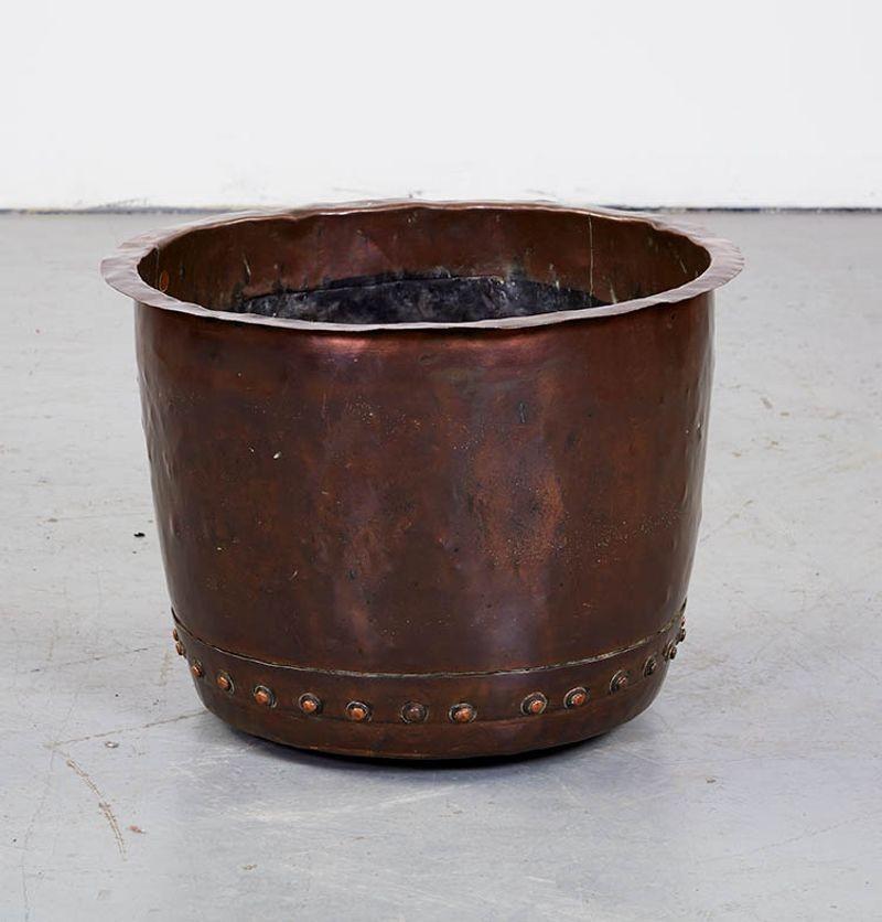 Good 19th century English hammered copper log bin, having 