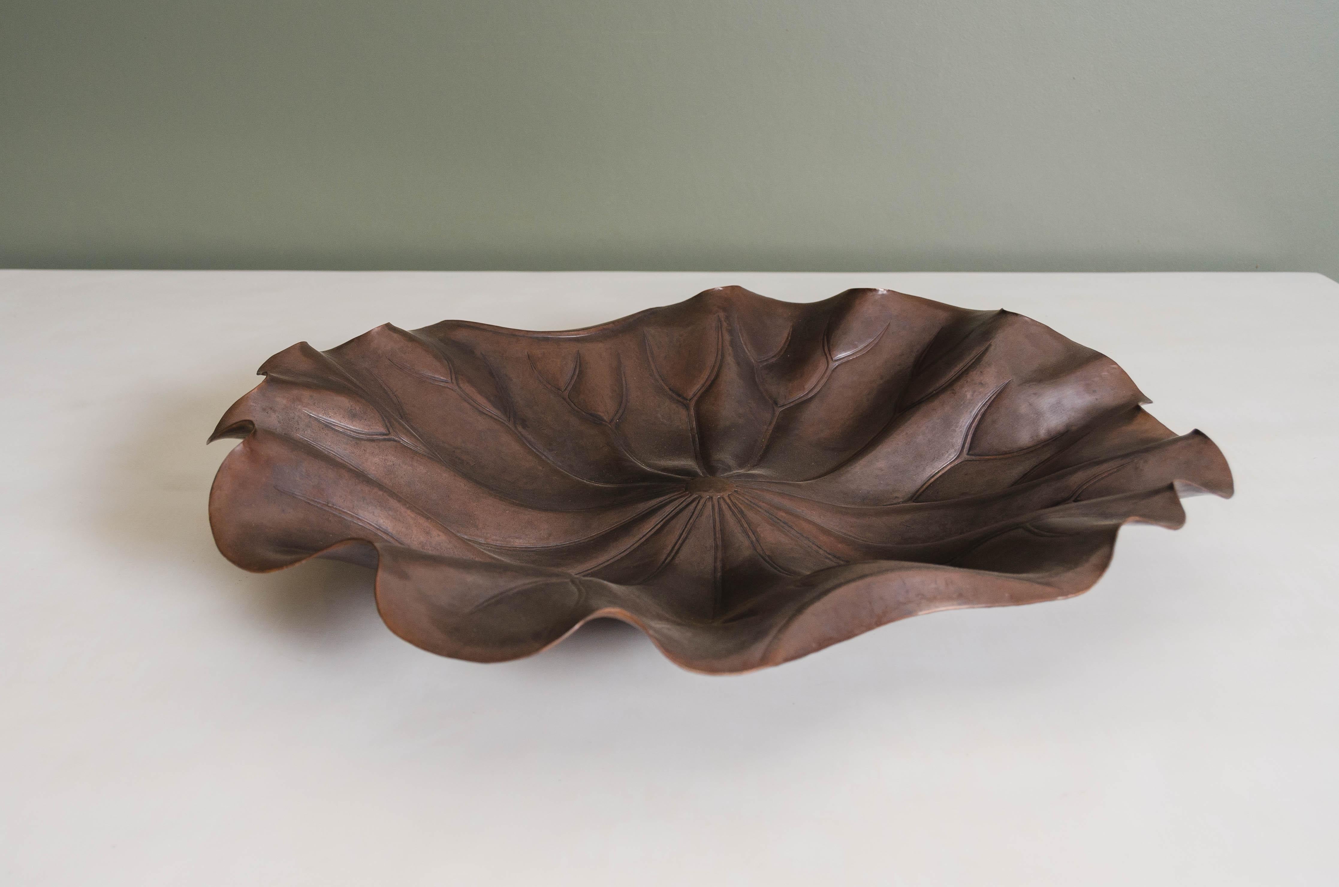 Lotus leaf plate
Antique copper
Hand Repoussé
Limited edition
Contemporary
Each piece is individually crafted and is unique.
Repoussé is the traditional art of hand-hammering decorative relief onto sheet metal. The technique originated circa