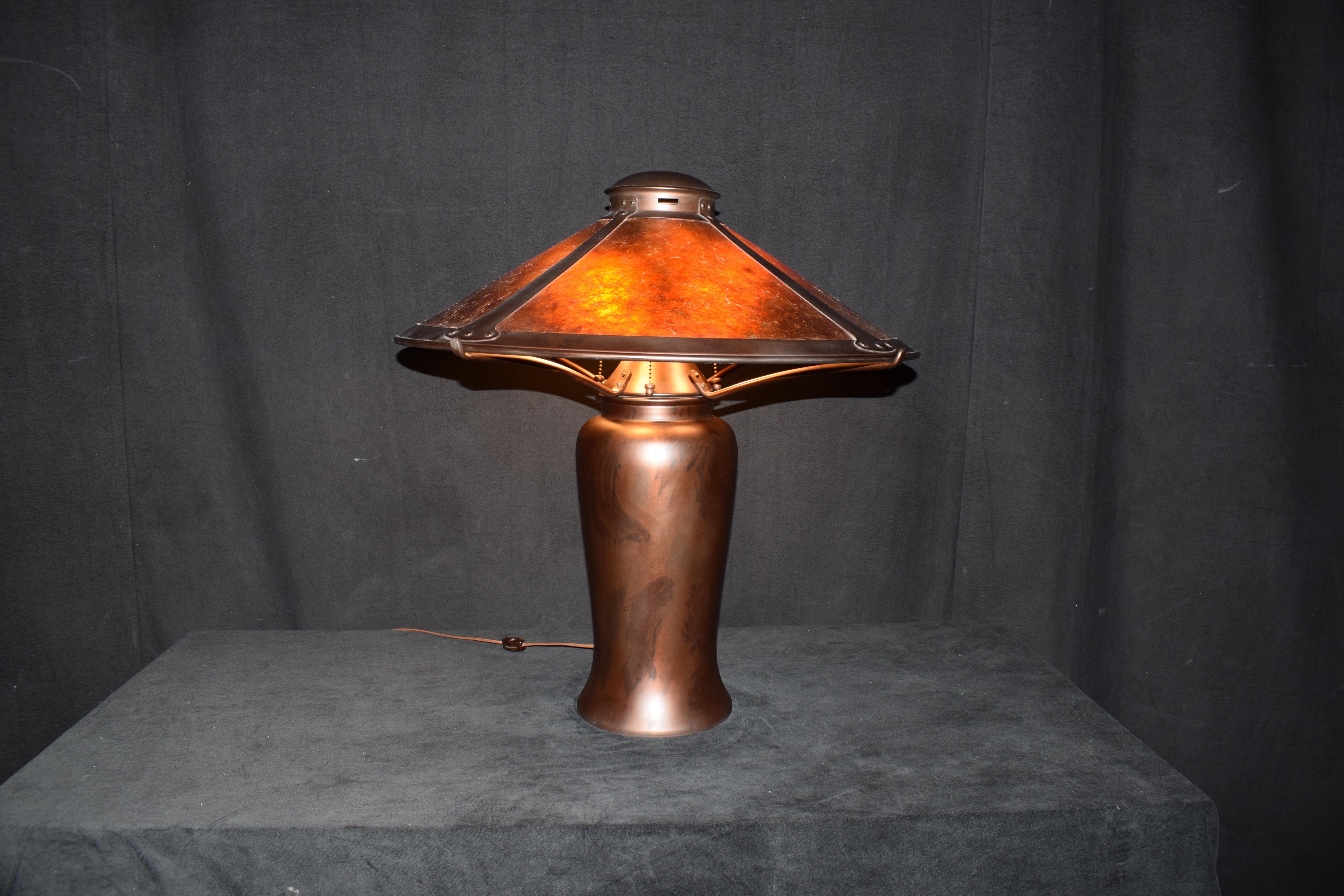 A very fine and decorative copper lamp featuring a copper and mica shade.
Dimensions: H 25