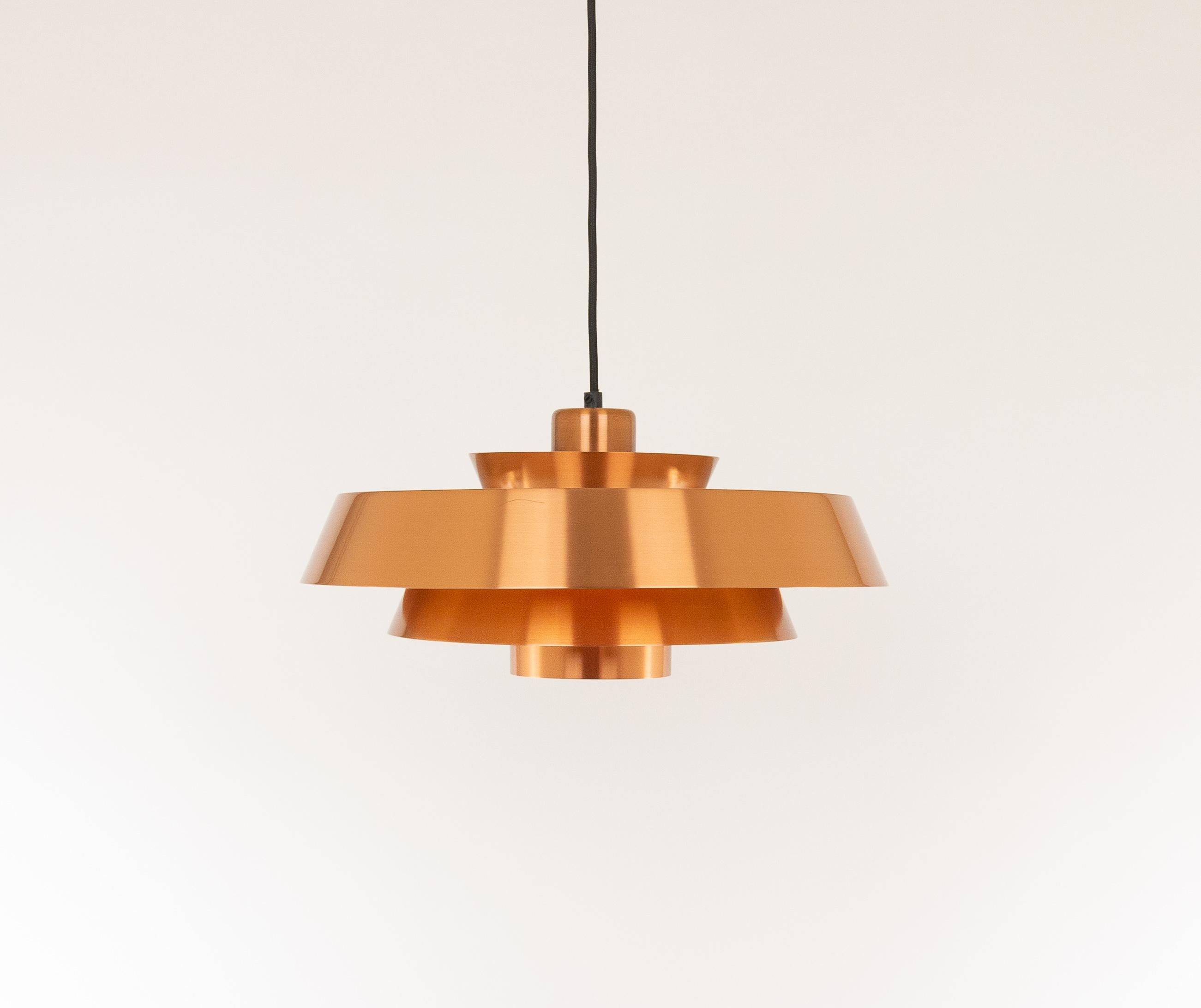 Copper Nova pendant designed in the 1960s by Jo Hammerborg, main designer of Danish lighting manufacturer Fog & Mørup in the 1960s and 1970s.

Nova was produced in three different types of metal - copper, brass and aluminium. The lamp is lacquered
