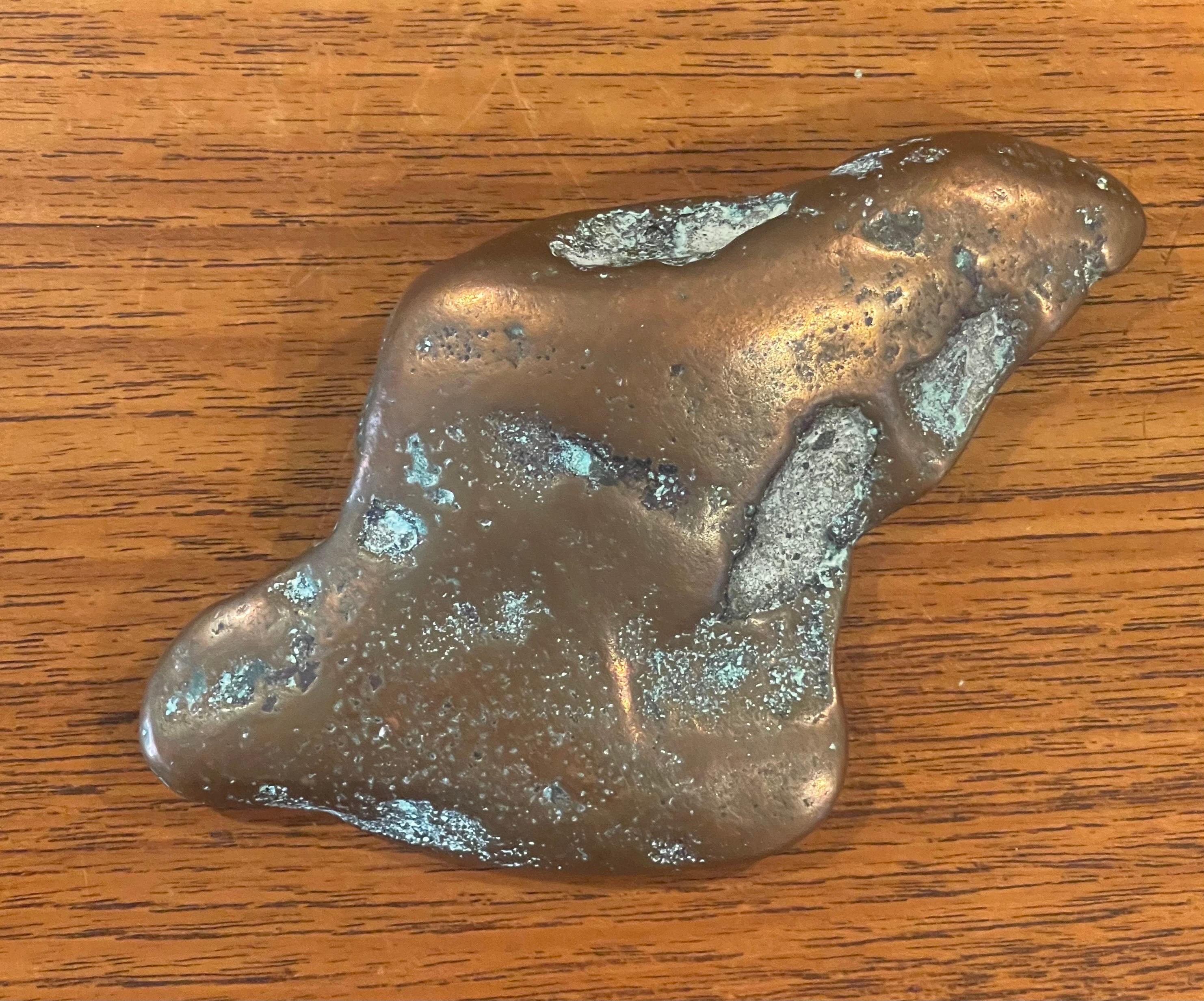 A very cool copper (I believe it is copper-not positive) ore ingot paperweight, circa 1970s. The piece is in good vintage condition with a nice patina and measures 5.5