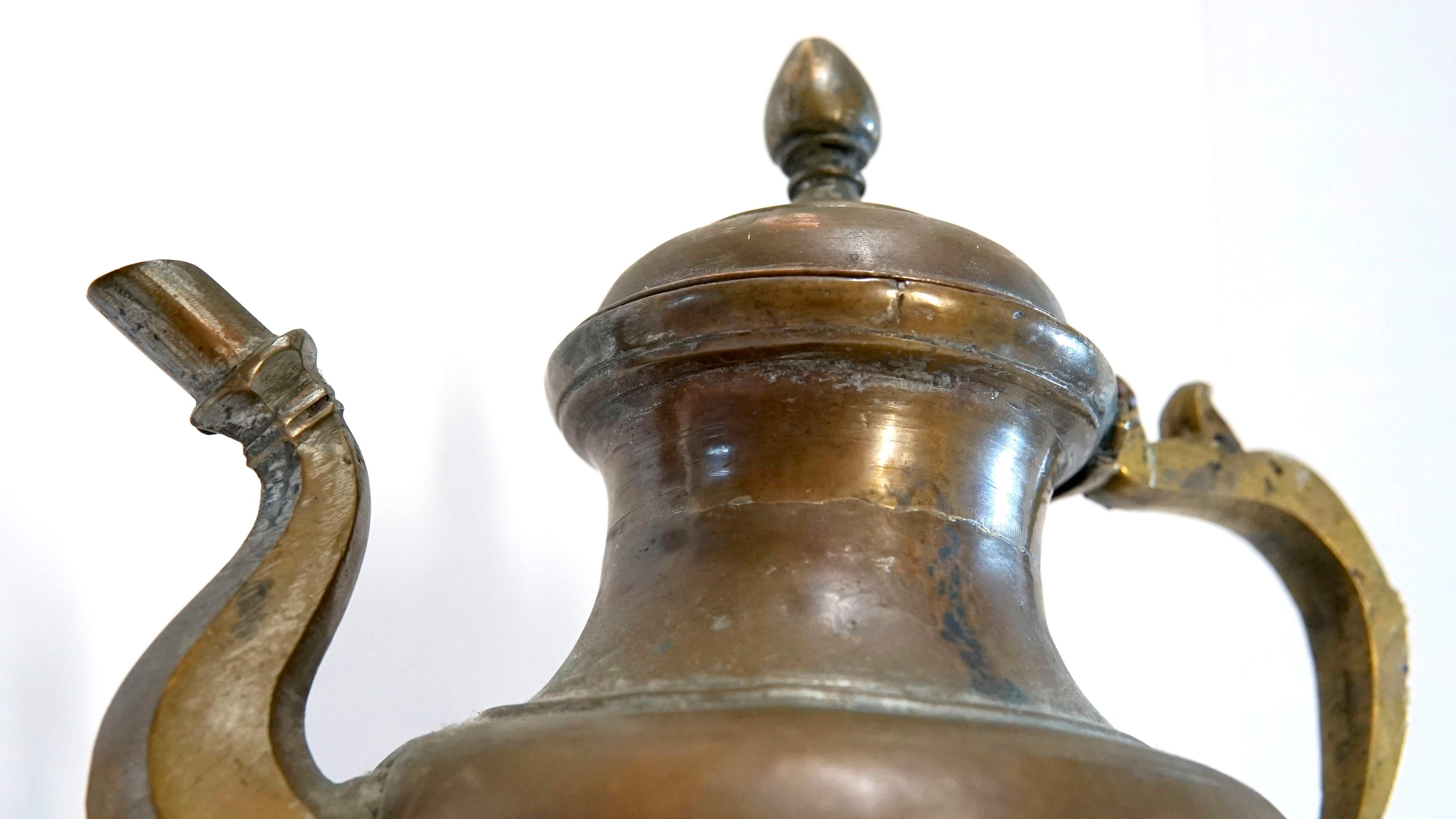 This Ottoman Empire copper kettle has a beautiful patina and the Ottoman mark built into the handle. This is part of a collection of Ottoman pieces from Istanbul that includes artifacts that were actually used in camps and at the city gates (water