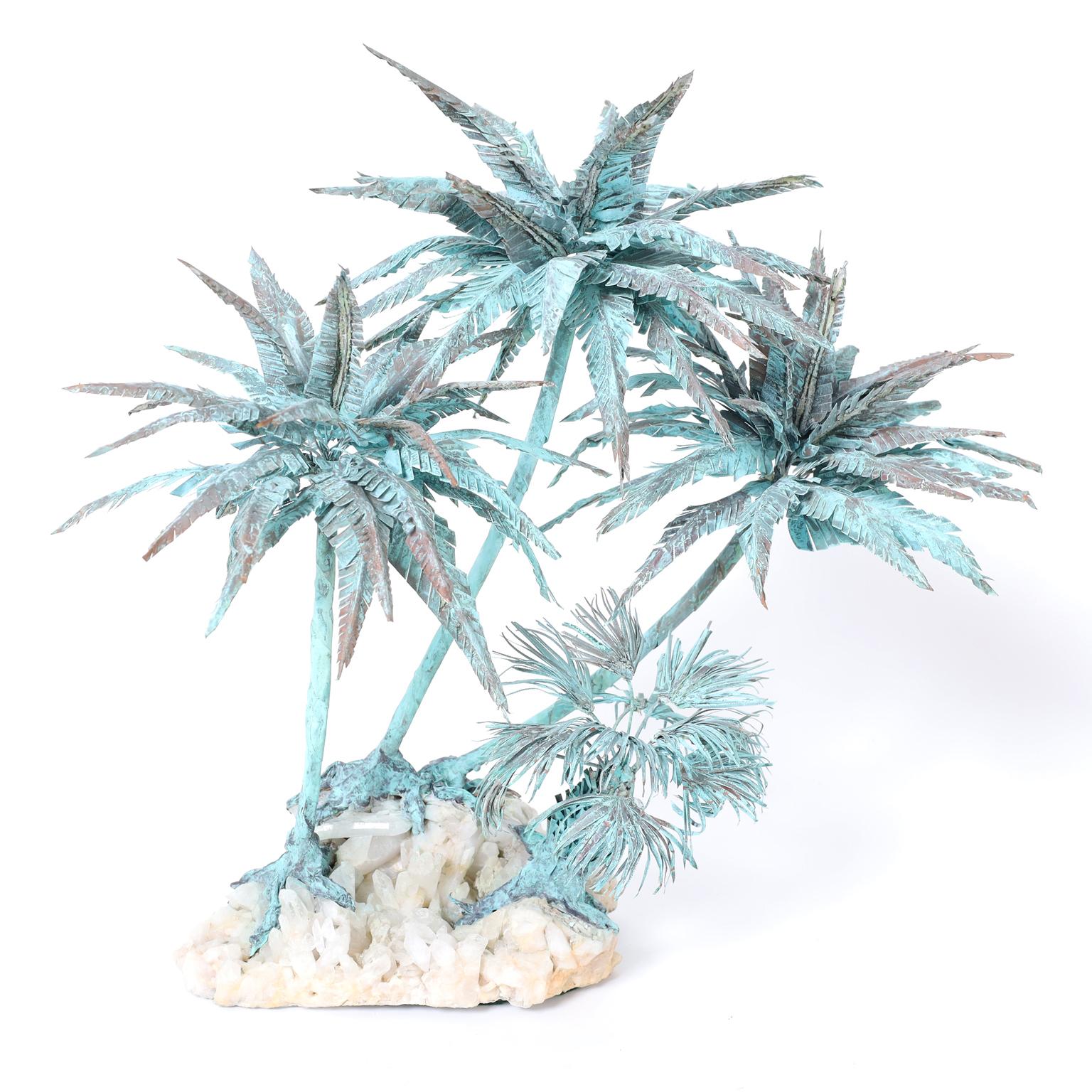 Mid century sculpture or object of art composed with four copper palm trees having a verdigris patina on a stone base.