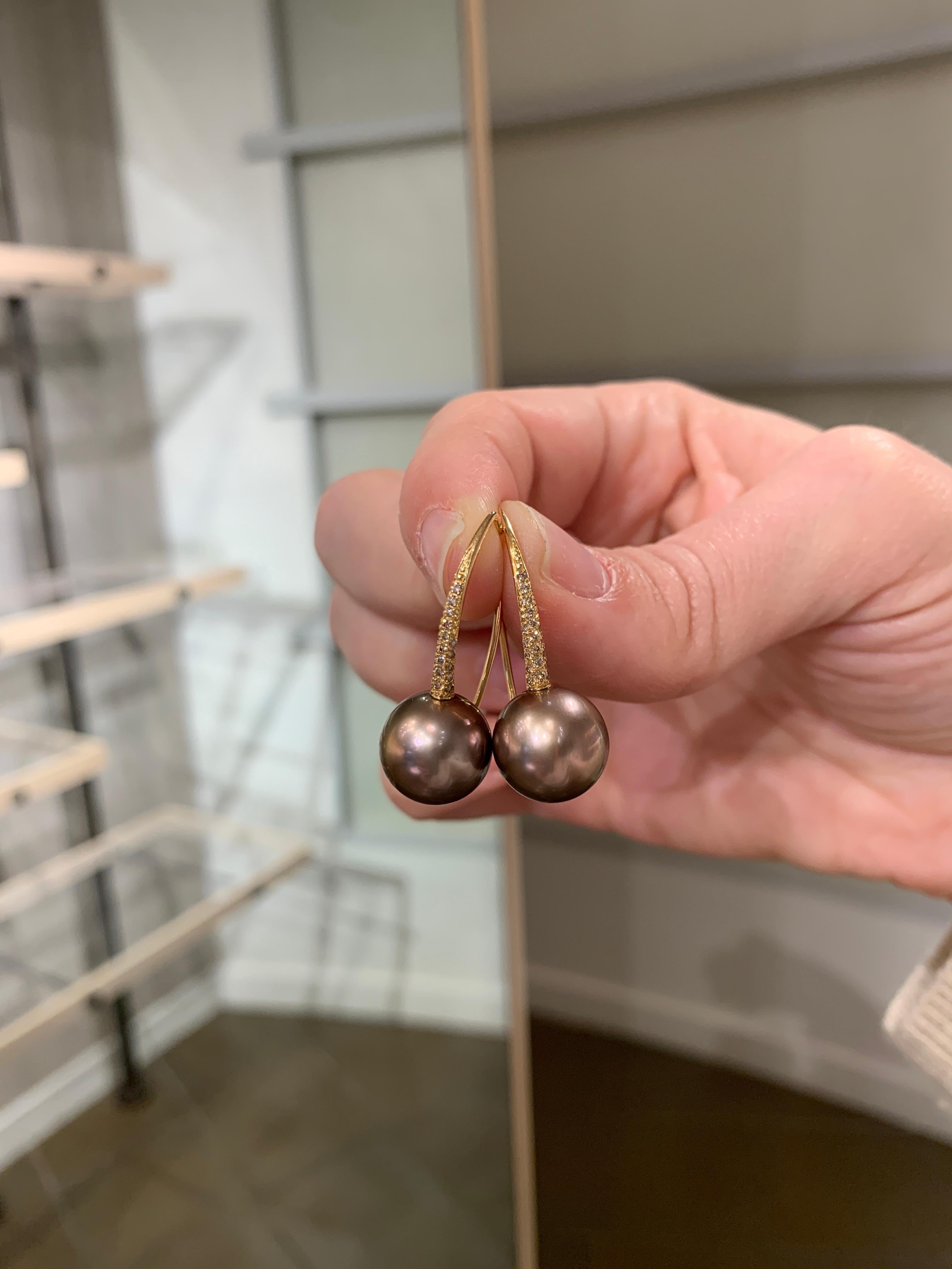 Rose Drop Earrings hand-fabricated in Germany by award-winning jewelry maker Jorg Gellner showcasing a phenomenal, matched pair of natural 12mm round metallic copper pink Tahitian pearls accented with 0.25 total carats or shimmering round