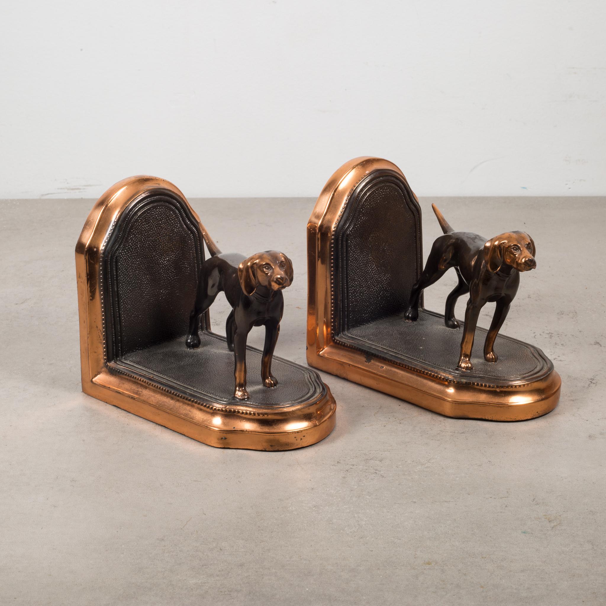 About

This is a pair of original copper-plated bookends of pointer dogs with faux leather pattern. Both bookends are in good condition and have retained their copper finish and have the appropriate patina consistent with age and use. The felt on