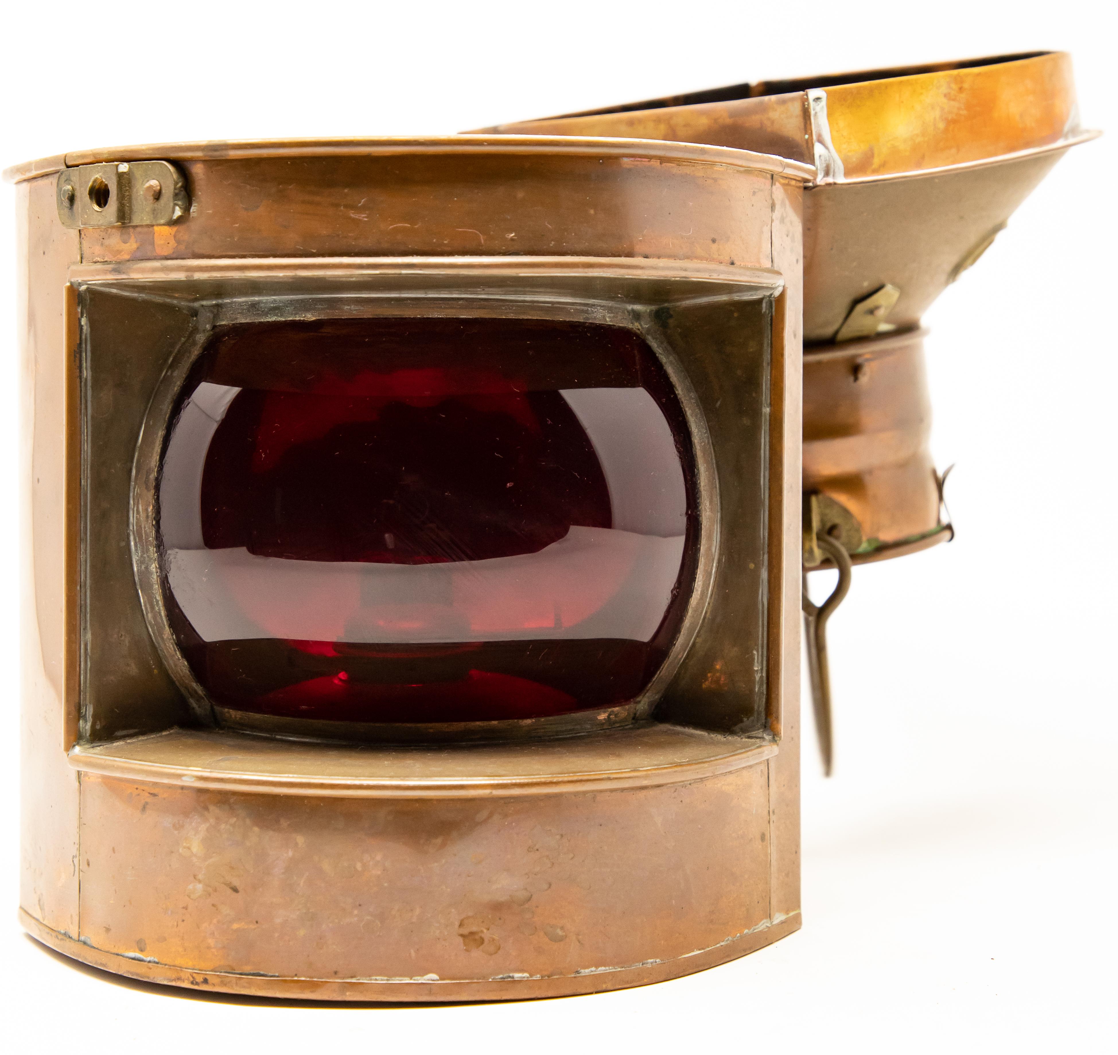 Offering this port ship lantern by Tung Woo out of Hong Kong. Gorgeous patina grace this lantern. Has a beautiful red glass for the light to pass through.