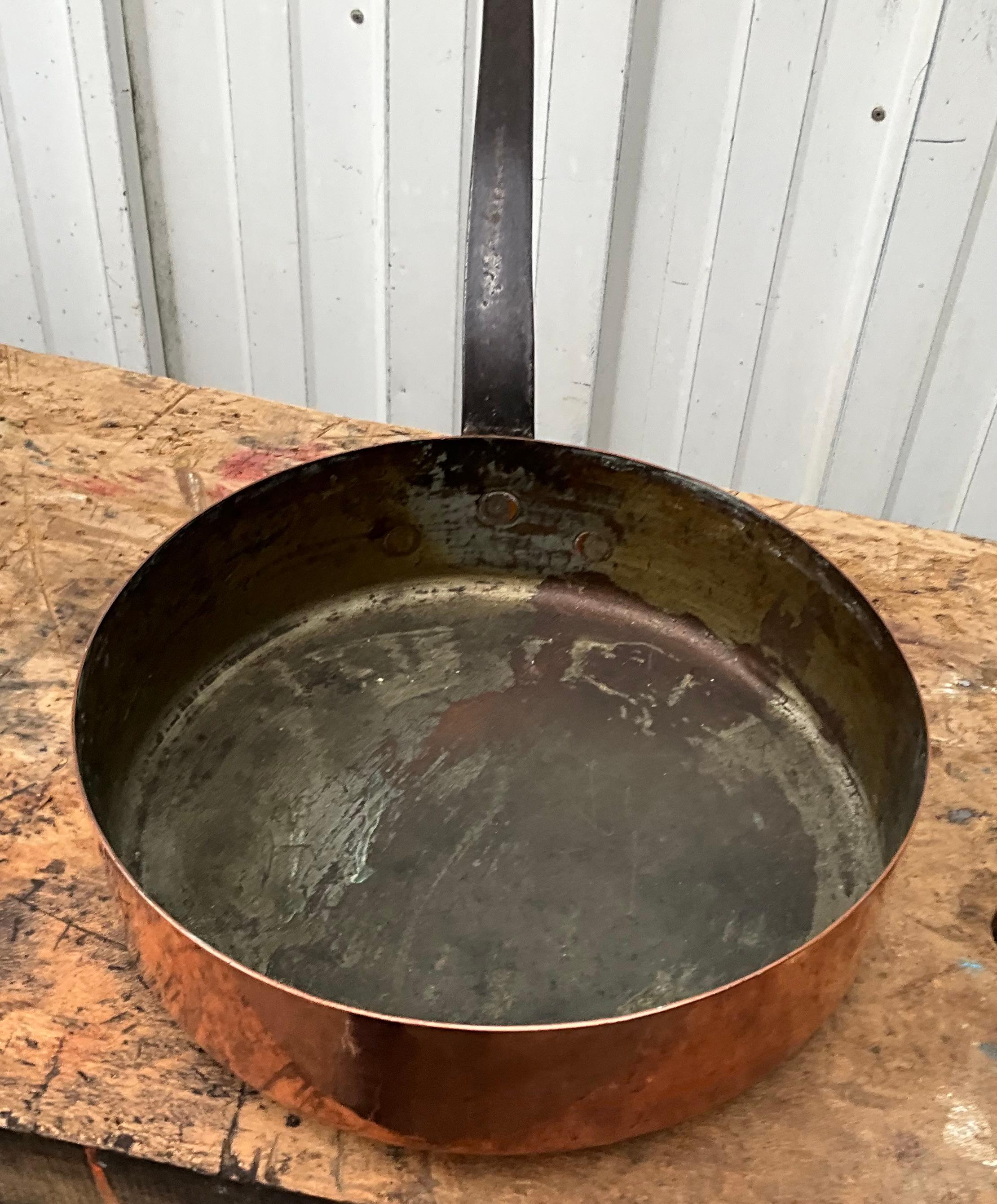 This French copper sauté pan is from the 19th century. it was hand-forged in Villedieu-les-Poêles in Normandy.

It is of high quality, heavy and have a nice long riveted iron handle. Its patina is beautiful.

A beautiful copper sauté pan makes many