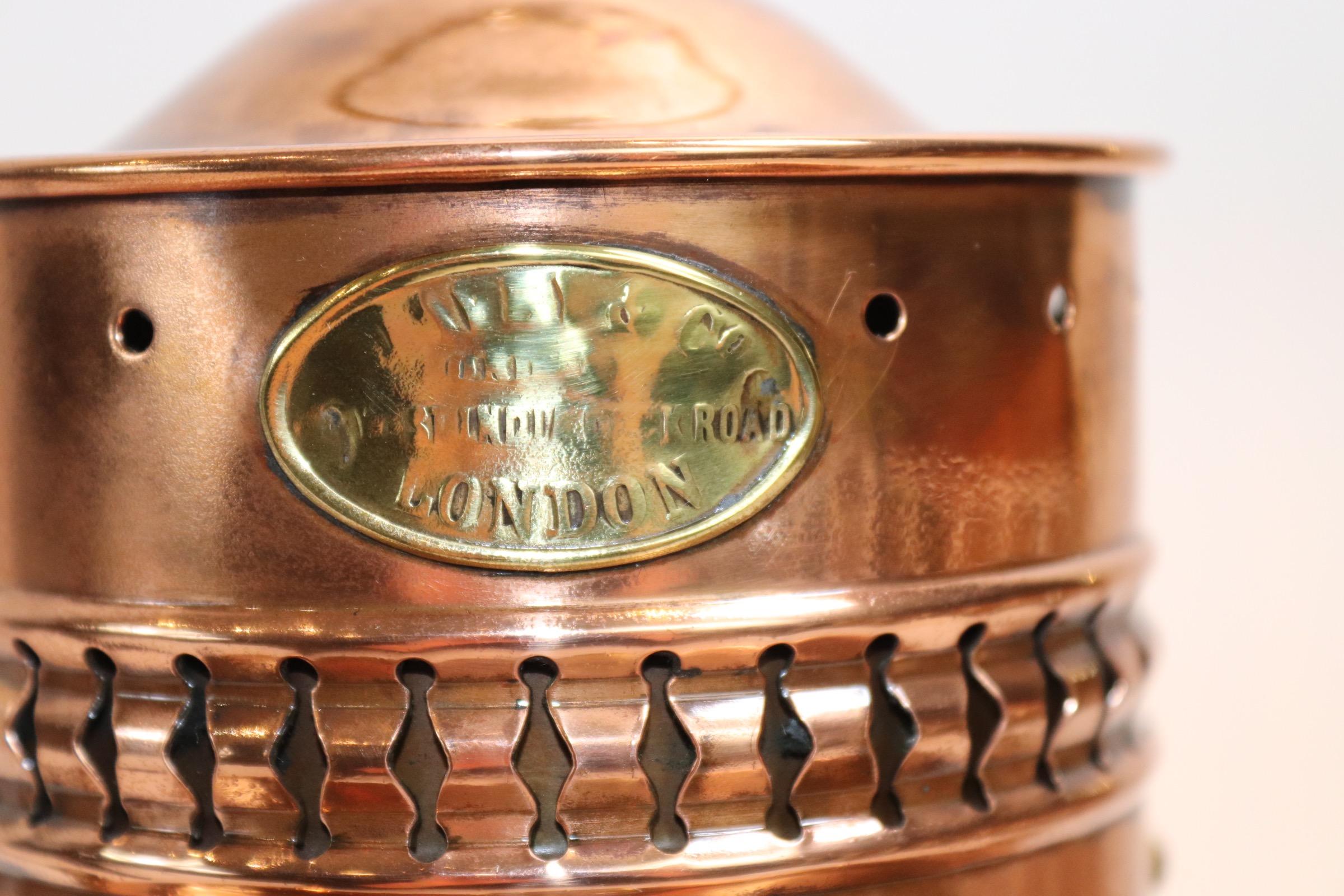 Solid copper ships cabin lantern with polished and lacquered finish. Original burner is intact with electric socket added from above for home display. With brass badge from maker Davey & Co. London Weight is 7 pounds.